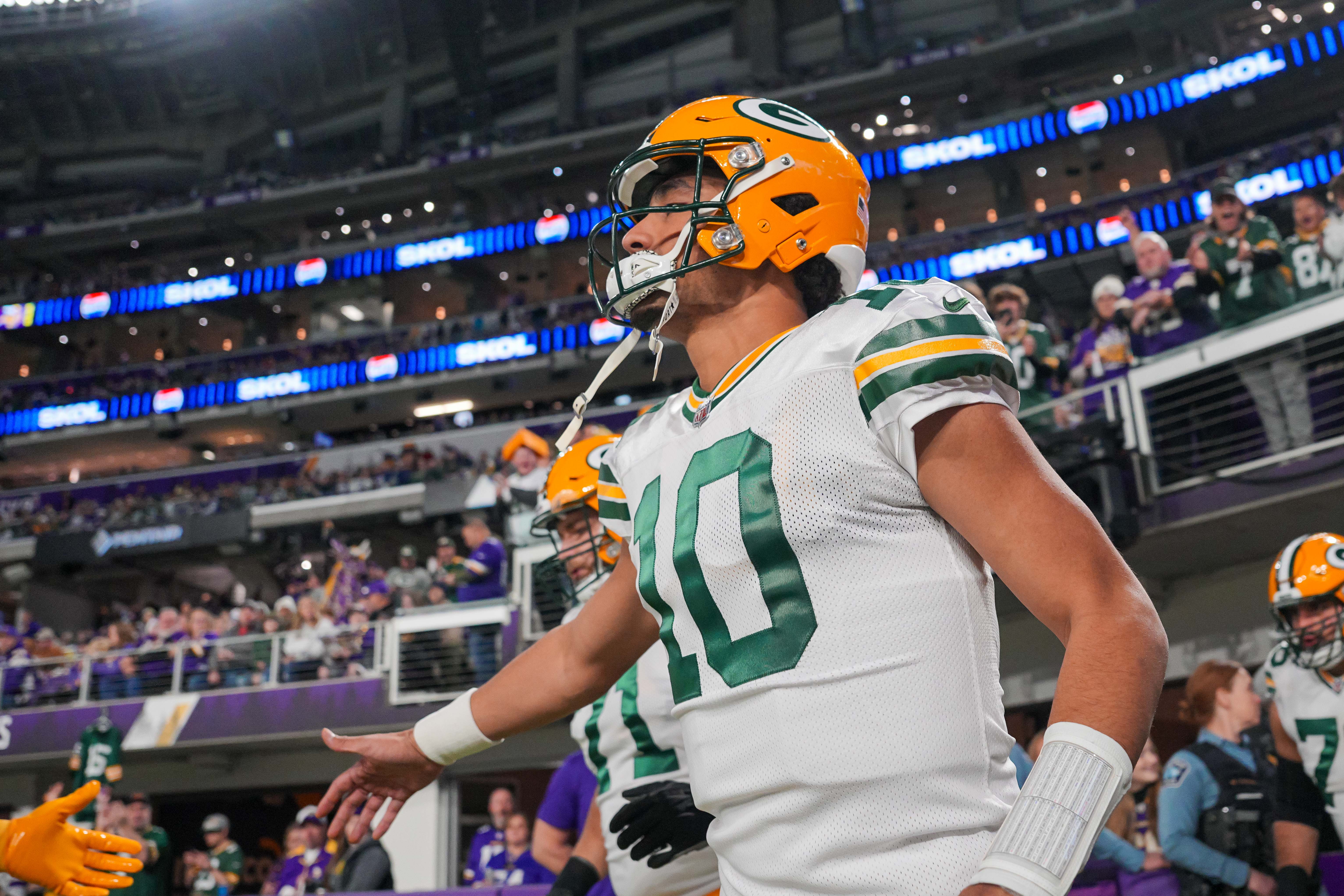 Green Bay Packers quarterback Jordan Love (10) takes the field before the game against the Minnesota Vikings at U.S. Bank Stadium.