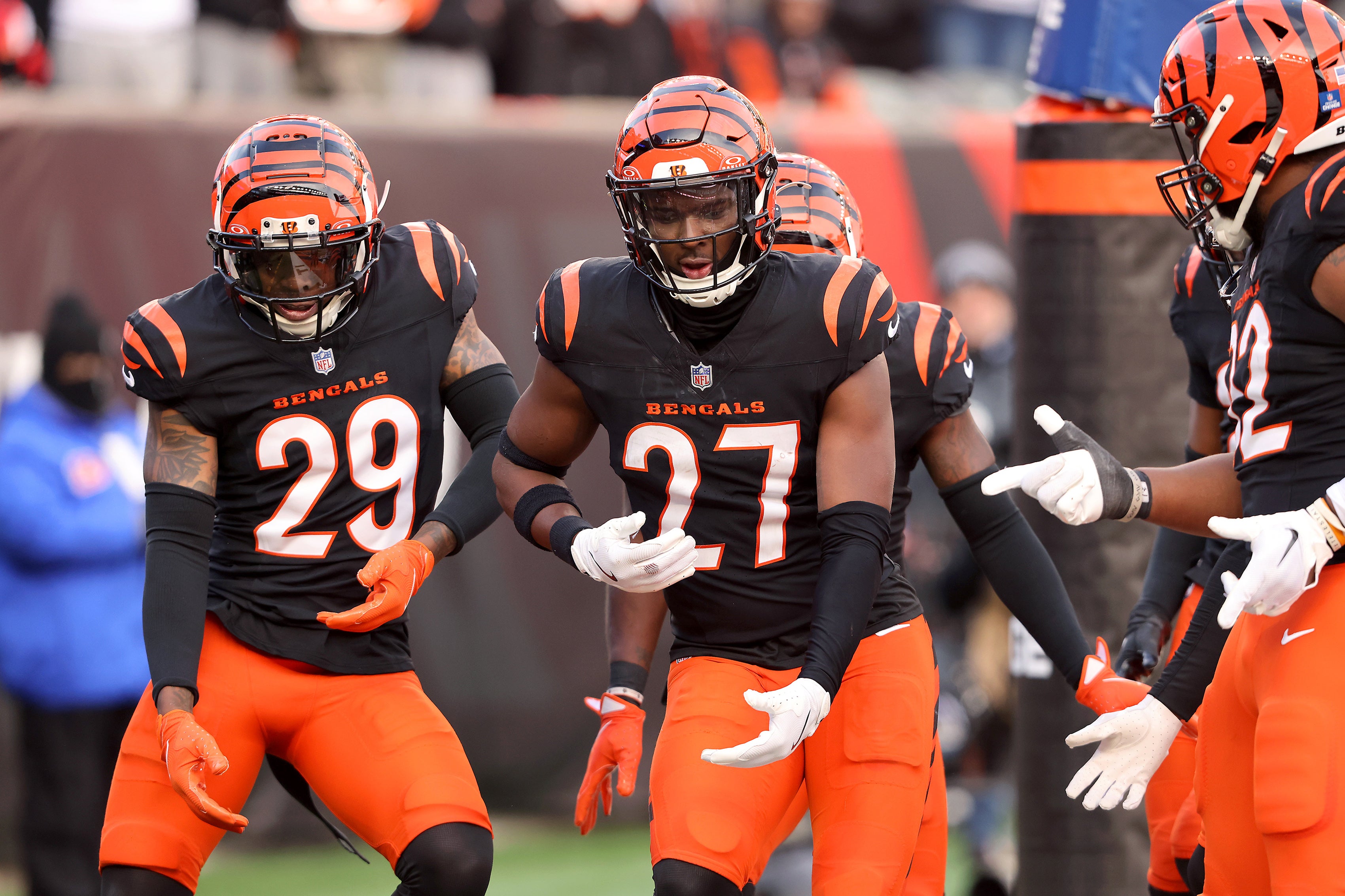 Dec 22, 2024; Cincinnati, Ohio, USA; Cincinnati Bengals safety Jordan Battle (27) celebrates an interception with cornerback Cam Taylor-Britt (29) during the fourth quarter against the Cleveland Browns at Paycor Stadium.