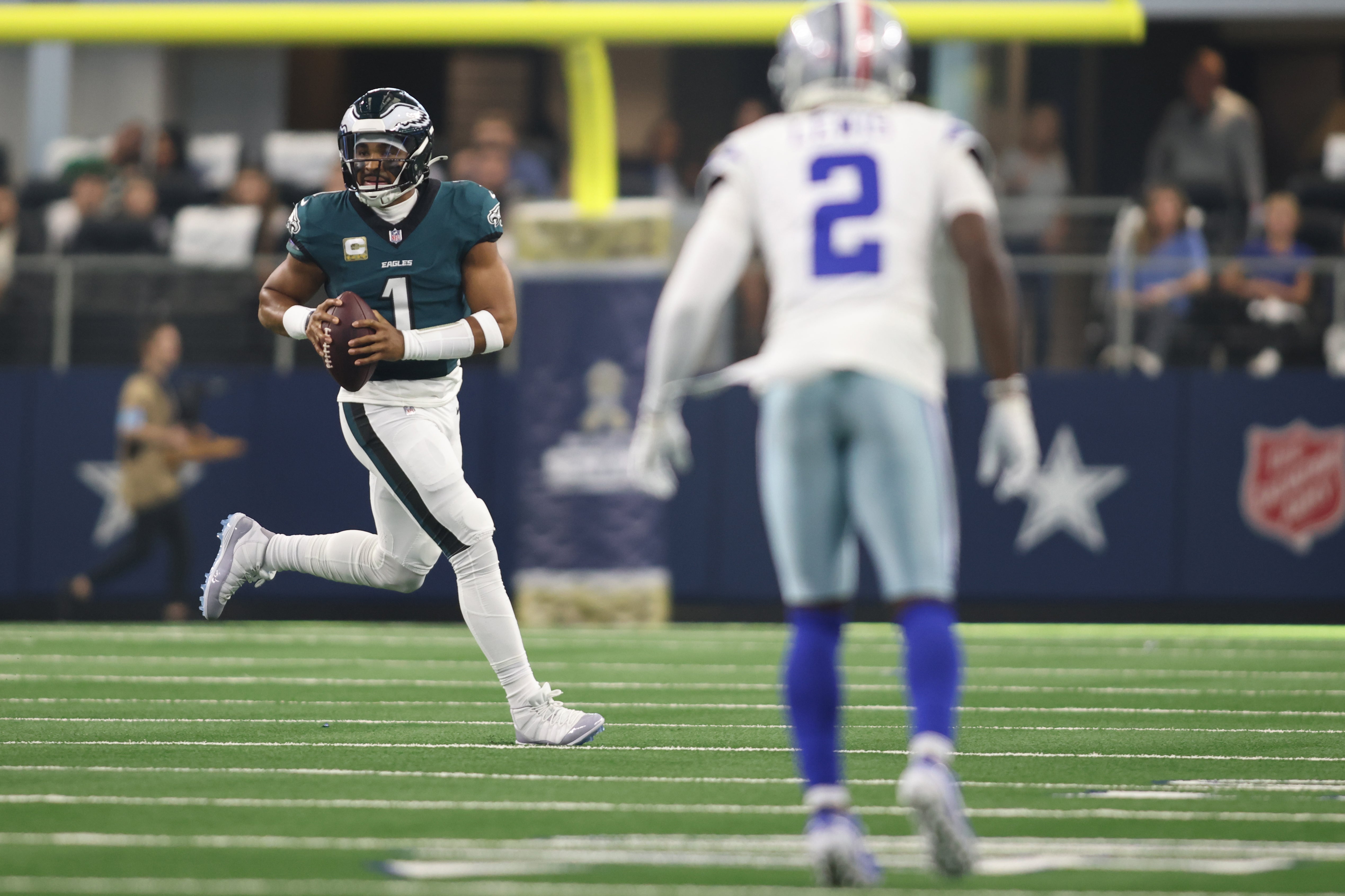 Philadelphia Eagles quarterback Jalen Hurts (1) rolls out to pass against the Dallas Cowboys in the first quarter at AT&T Stadium.