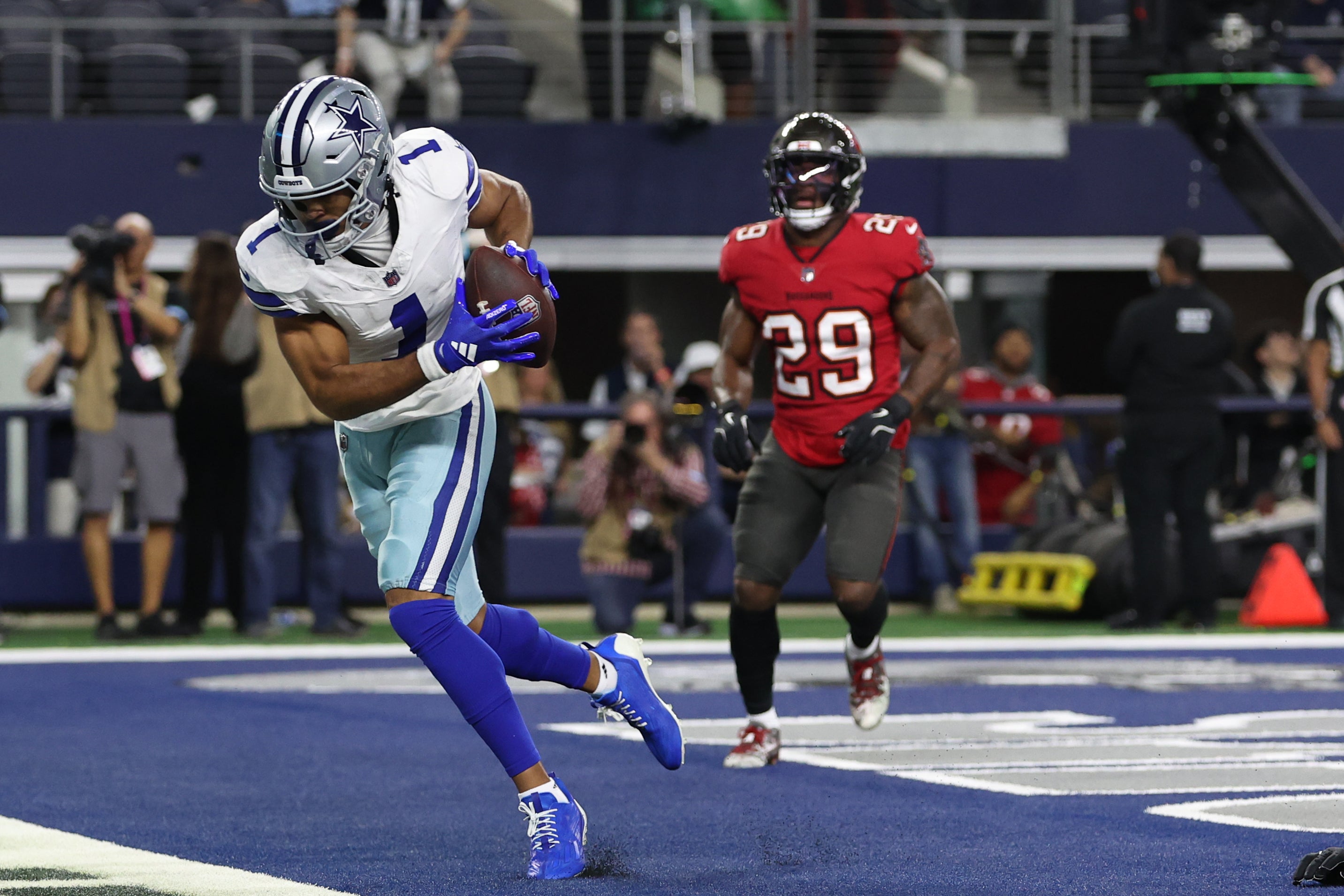 Dallas Cowboys wide receiver Jalen Tolbert (1) catches a touchdown pass against Tampa Bay Buccaneers linebacker Lavonte David (54) in the first quarter at AT&T Stadium.