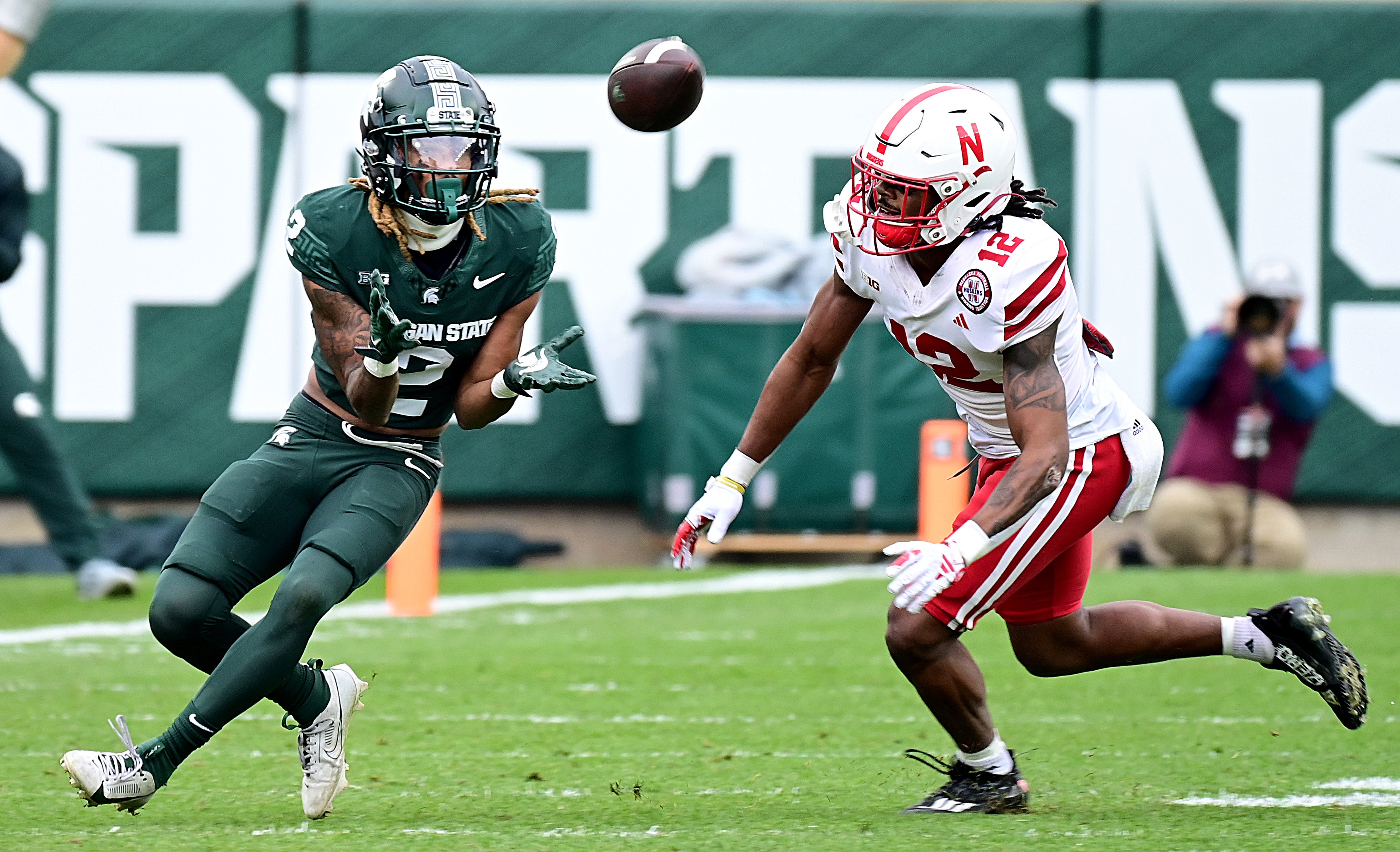 Michigan State Spartans wide receiver Tyrell Henry (2) pulls in a pass in the third quarter against Nebraska Cornhuskers defensive back Omar Brown (12) at Spartan Stadium.
