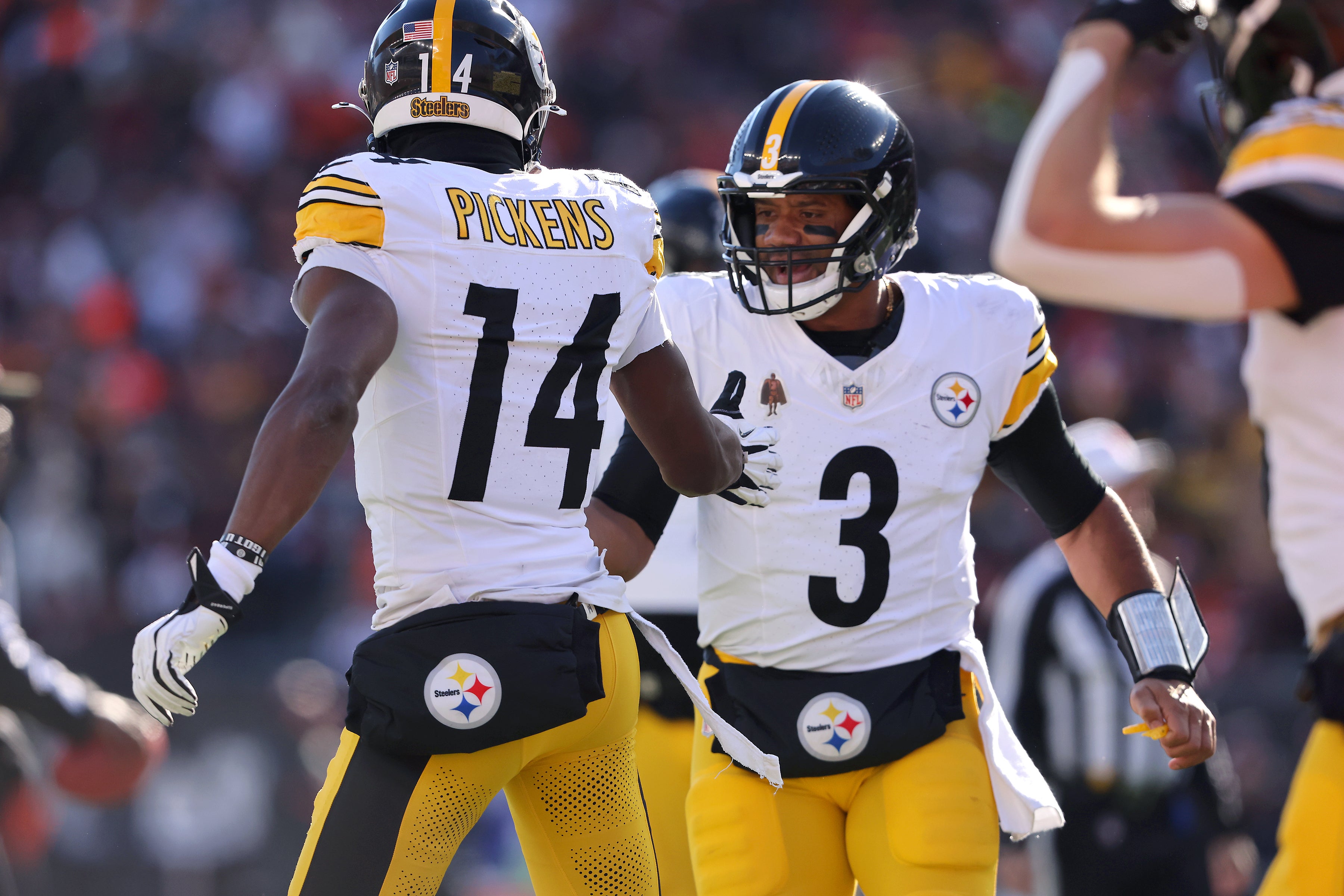 Dec 1, 2024; Cincinnati, Ohio, USA; Pittsburgh Steelers wide receiver George Pickens (14) celebrates his touchdown catch with quarterback Russell Wilson (3) during the first quarter against the Cincinnati Bengals at Paycor Stadium.