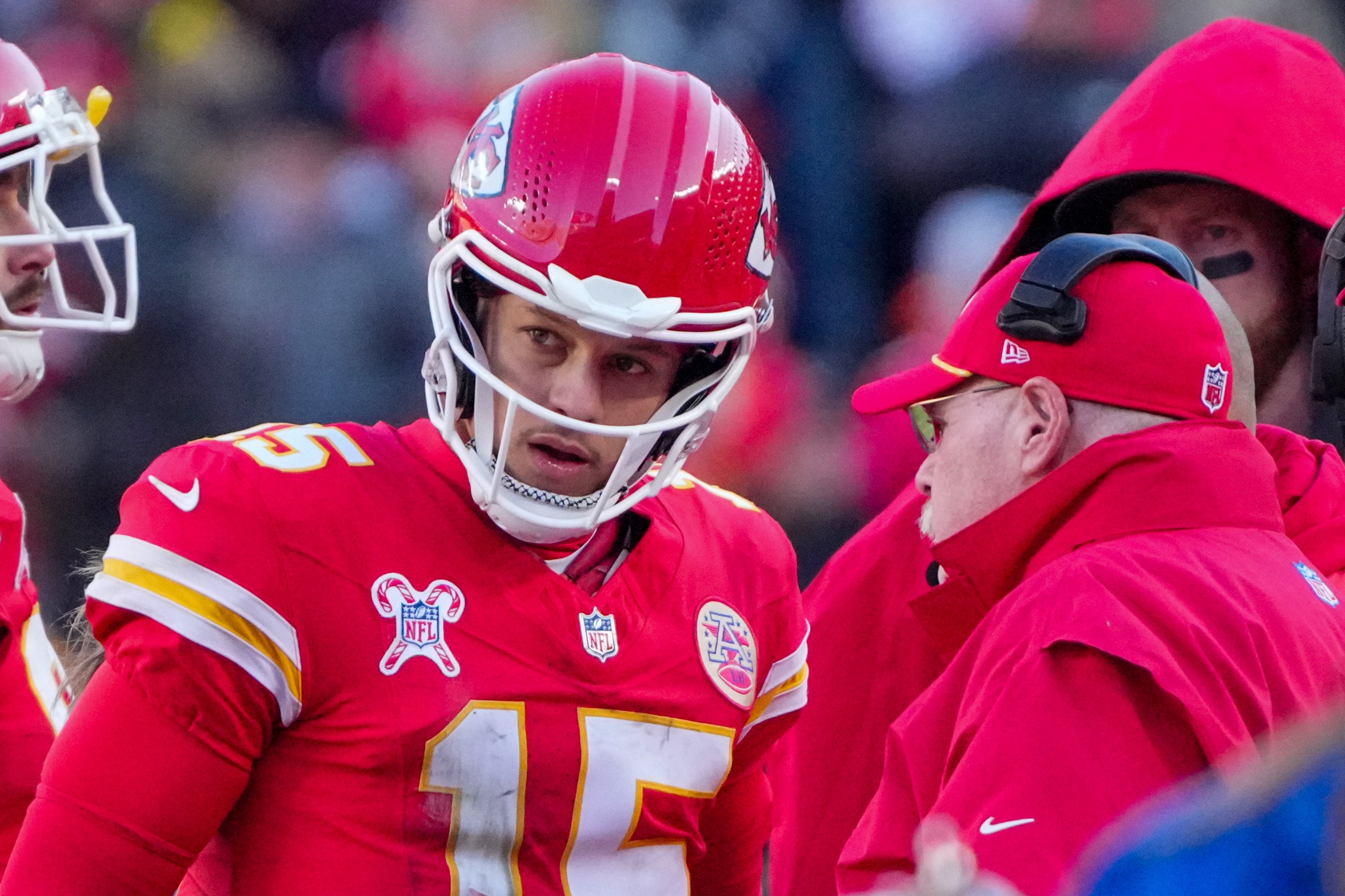 Dec 21, 2024; Kansas City, Missouri, USA; Kansas City Chiefs quarterback Patrick Mahomes (15) talks with head coach Andy Reid during the second half against the Houston Texans at GEHA Field at Arrowhead Stadium.