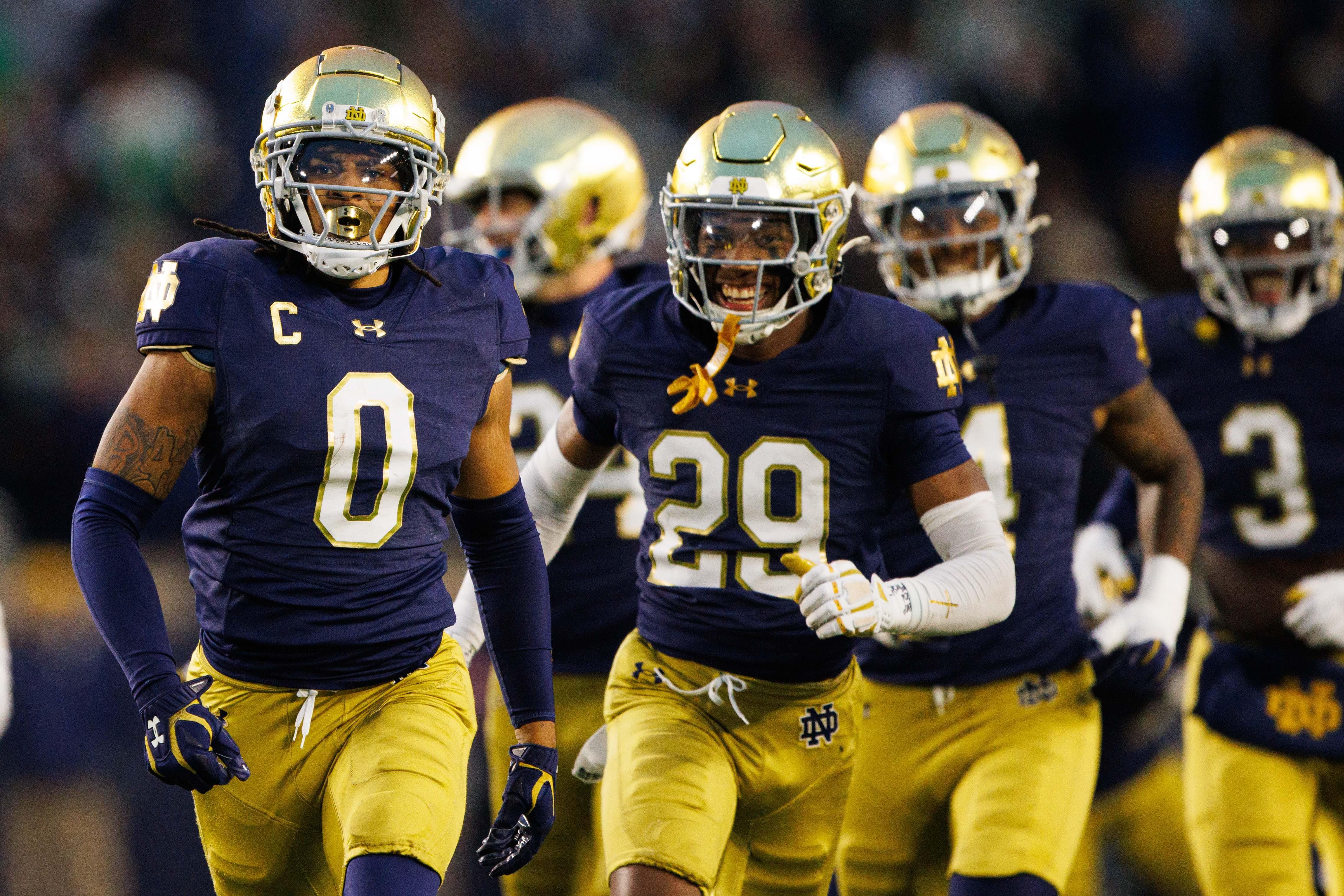 Notre Dame safety Xavier Watts (0) celebrates getting an interception during a NCAA college football game against Virginia at Notre Dame Stadium on Saturday, Nov. 16, 2024, in South Bend.
