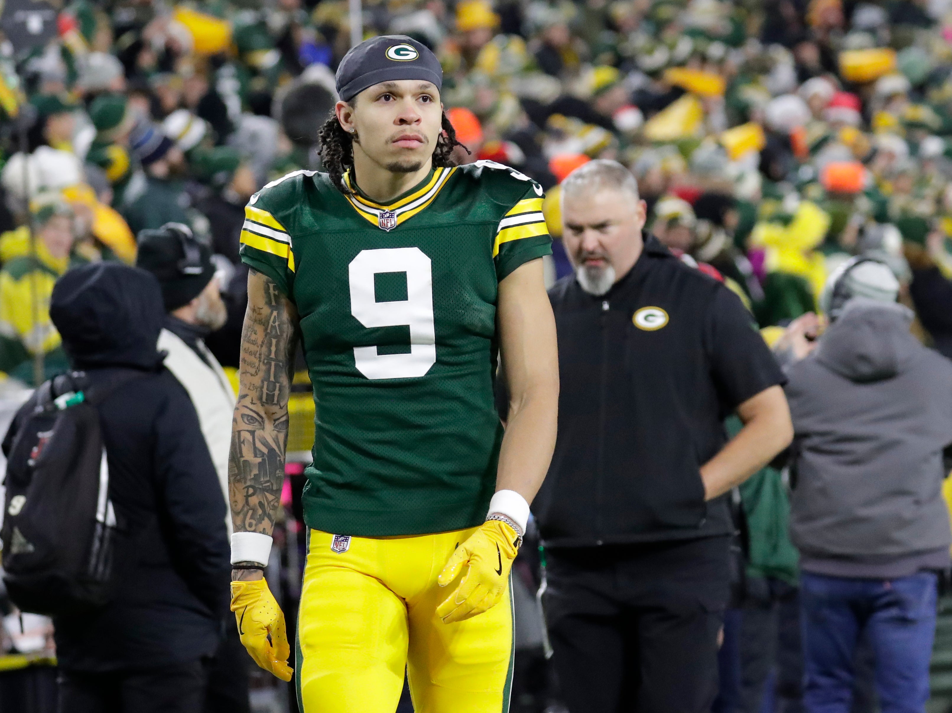 Green Bay Packers wide receiver Christian Watson (9) leaves the field in the fourth quarter after getting injured against the New Orleans Saints at Lambeau Field.