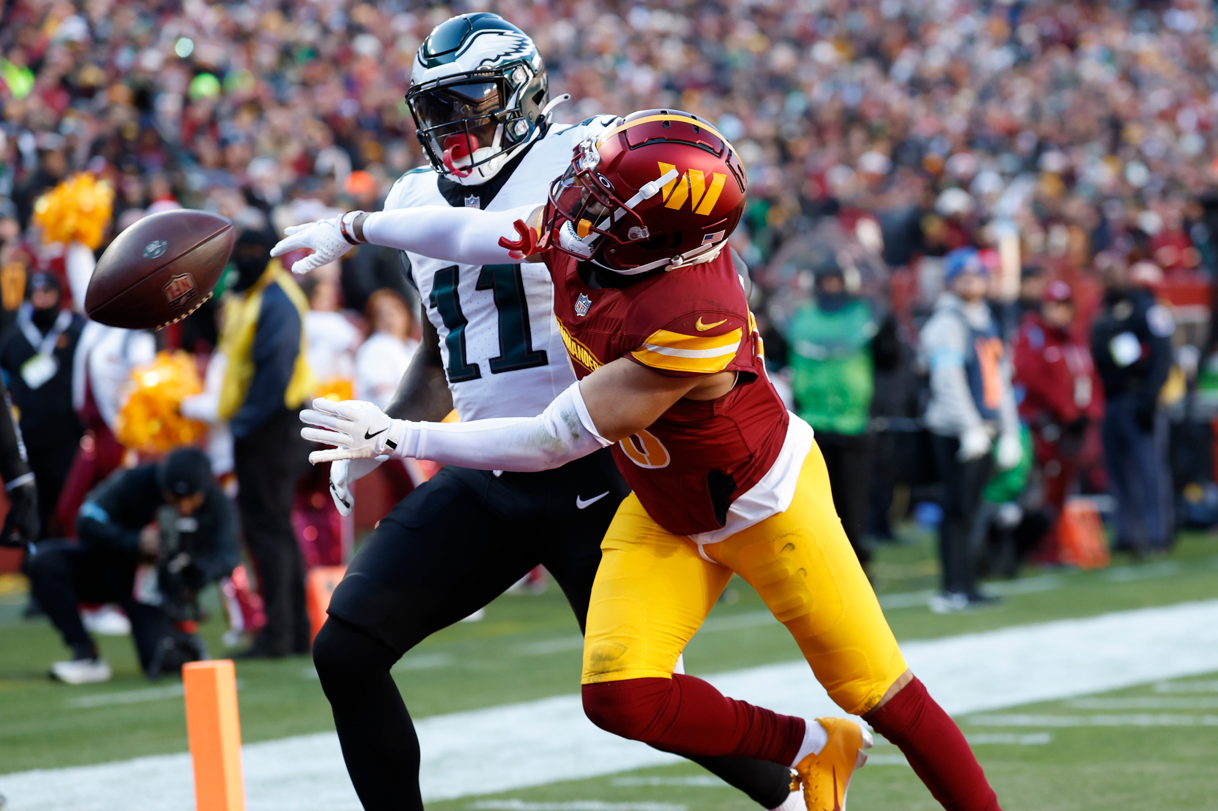 Dec 22, 2024; Landover, Maryland, USA; Washington Commanders cornerback Marshon Lattimore (23) defends a pass intended for Philadelphia Eagles wide receiver A.J. Brown (11) during the first quarter at Northwest Stadium.