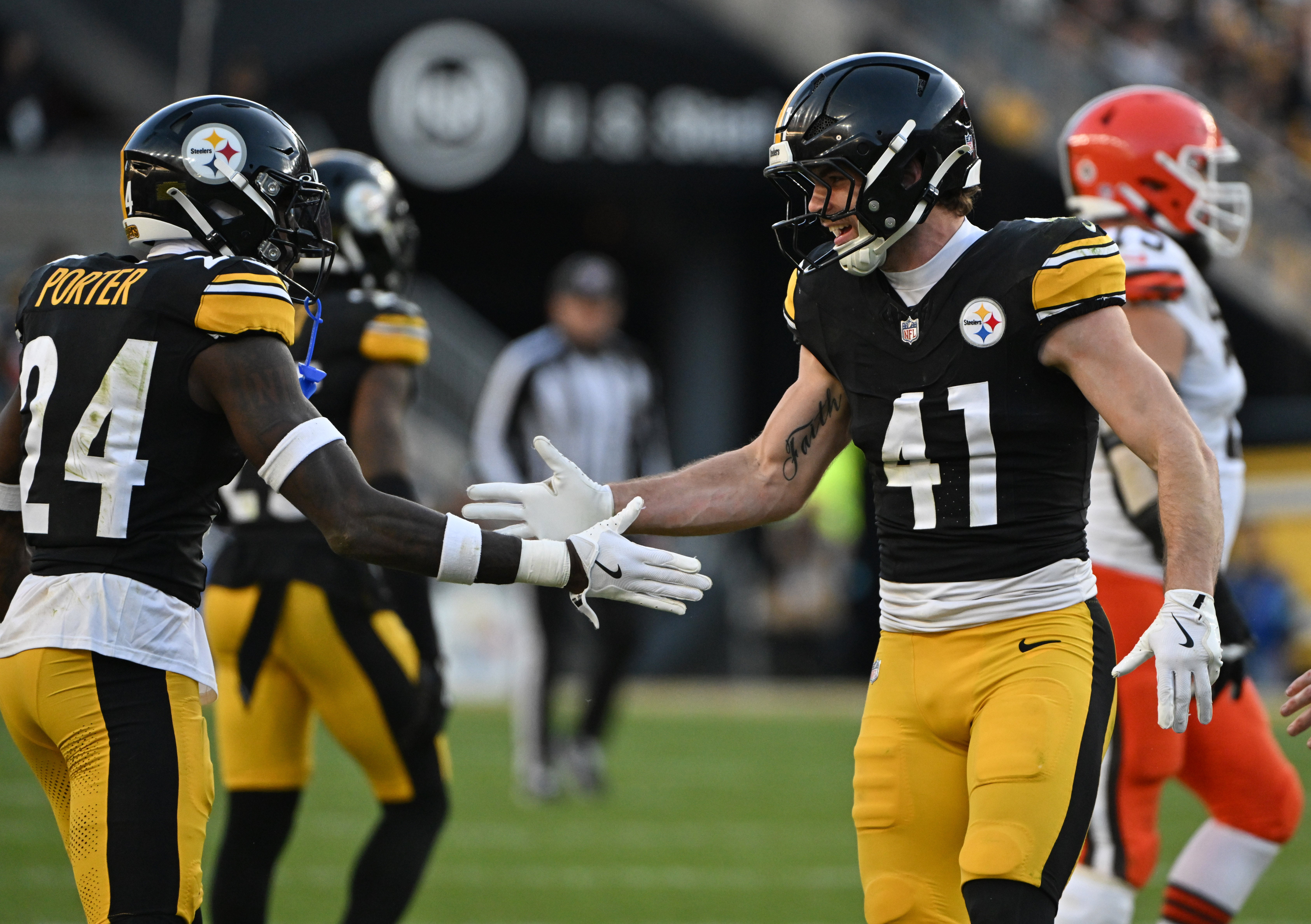 Dec 8, 2024; Pittsburgh, Pennsylvania, USA; Pittsburgh Steelers cornerback Joey Porter Jr. (24) celebrates a stop with Payton Wilson (41) against the Cleveland Browns during the third quarter at Acrisure Stadium.