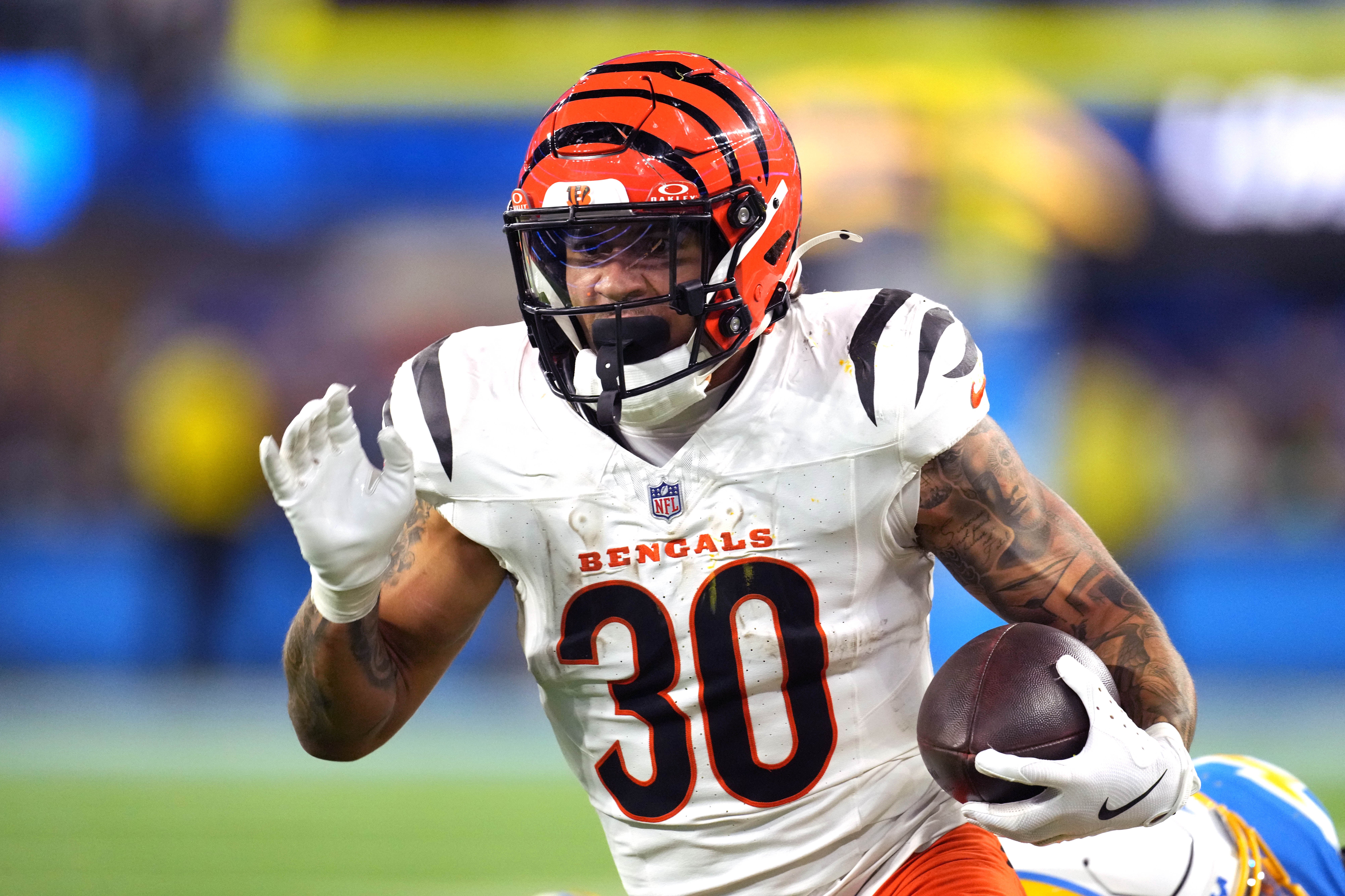 Nov 17, 2024; Inglewood, California, USA; Cincinnati Bengals running back Chase Brown (30) carries the ball against the Los Angeles Chargers in the second half at SoFi Stadium.