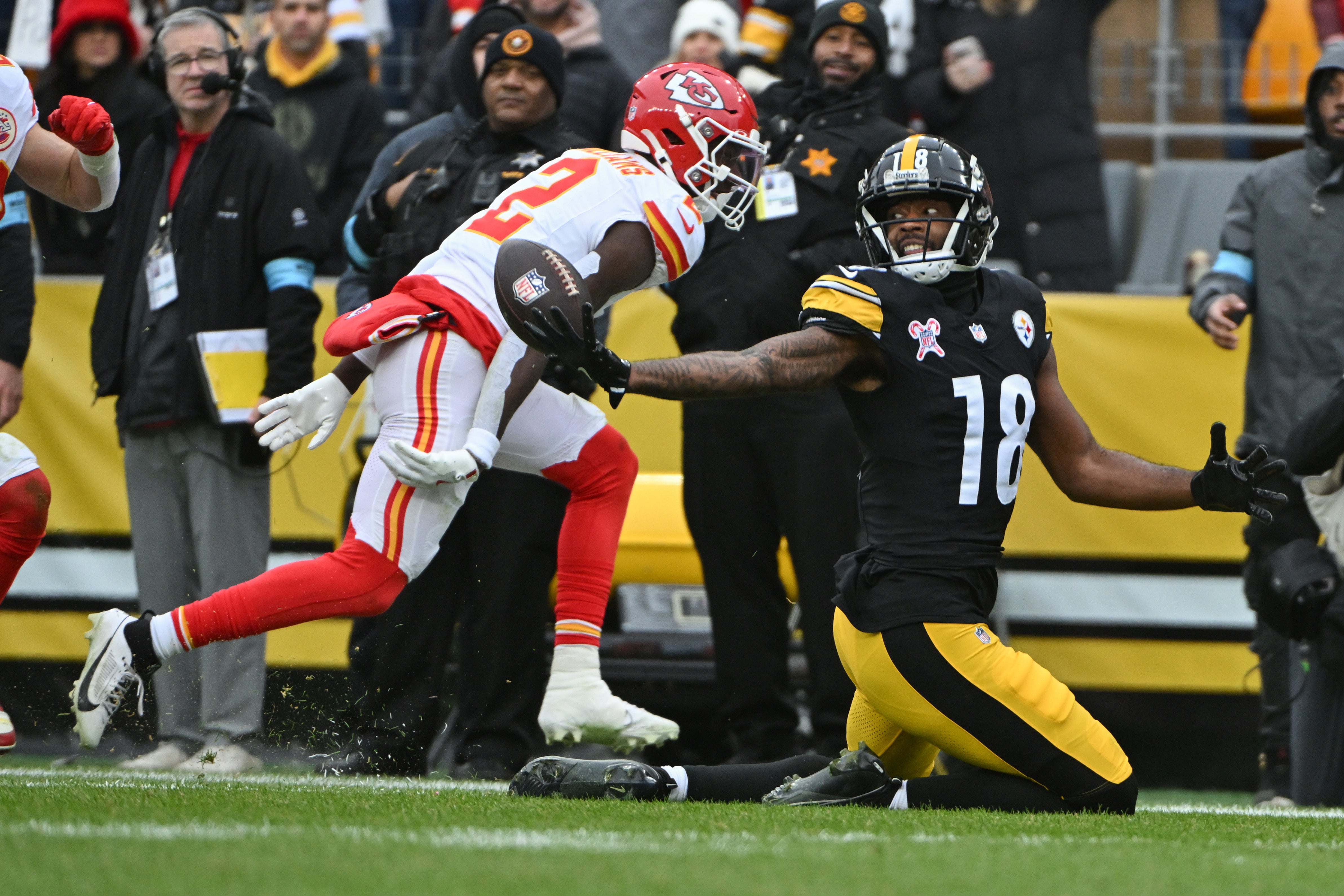 Dec 25, 2024; Pittsburgh, Pennsylvania, USA; Pittsburgh Steelers wide receiver Mike Williams (18) reaches for a pass that fell incomplete in front of Kansas City Chiefs cornerback Joshua Williams (2) )during the second quarter at Acrisure Stadium.