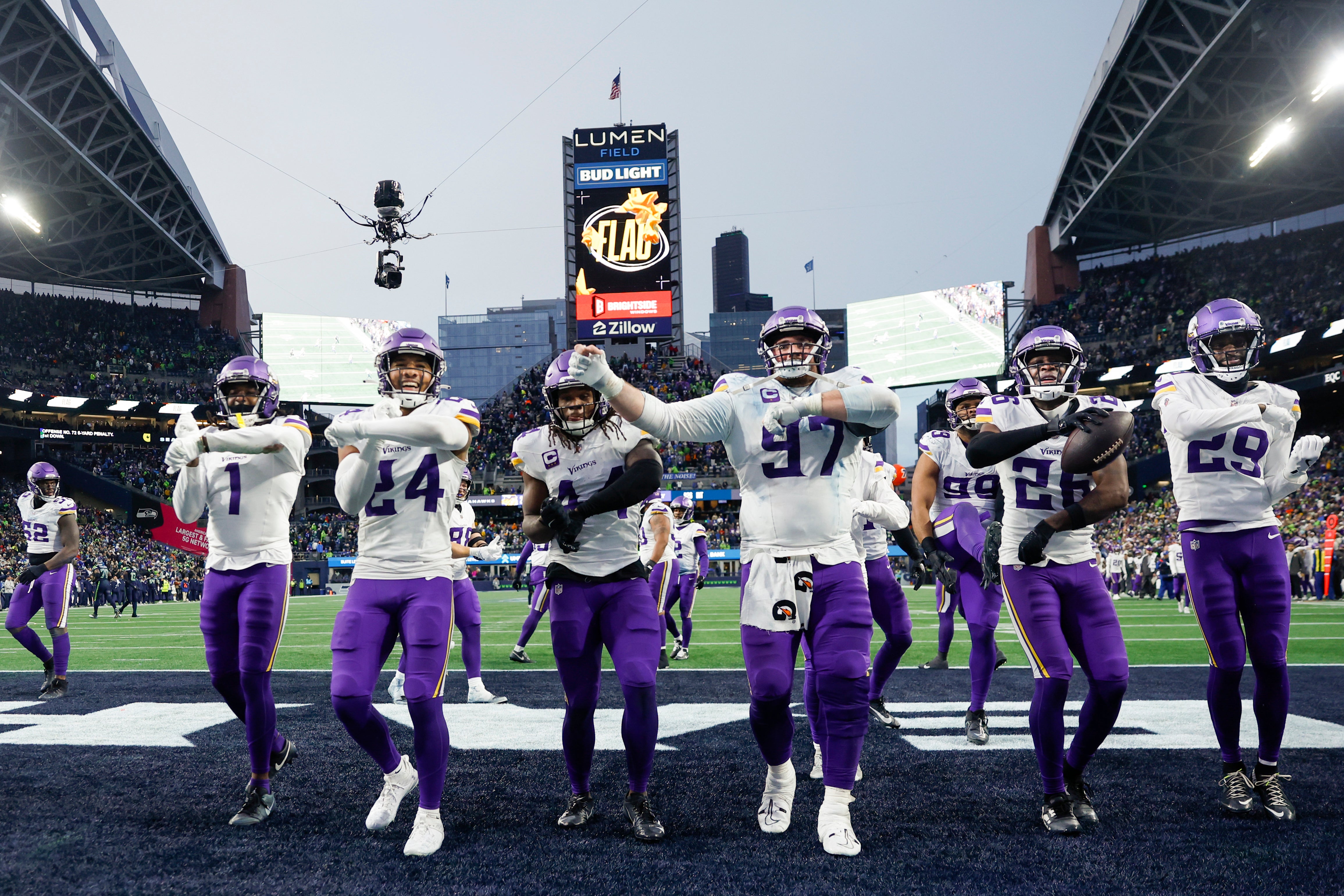 Dec 22, 2024; Seattle, Washington, USA; Minnesota Vikings safety Theo Jackson (26, second from right) leads a dance with cornerback Shaquill Griffin (1), safety Camryn Bynum (24), safety Josh Metellus (44), defensive tackle Harrison Phillips (97) and cornerback Dwight McGlothern (29) following his interception against the Seattle Seahawks during the fourth quarter at Lumen Field.