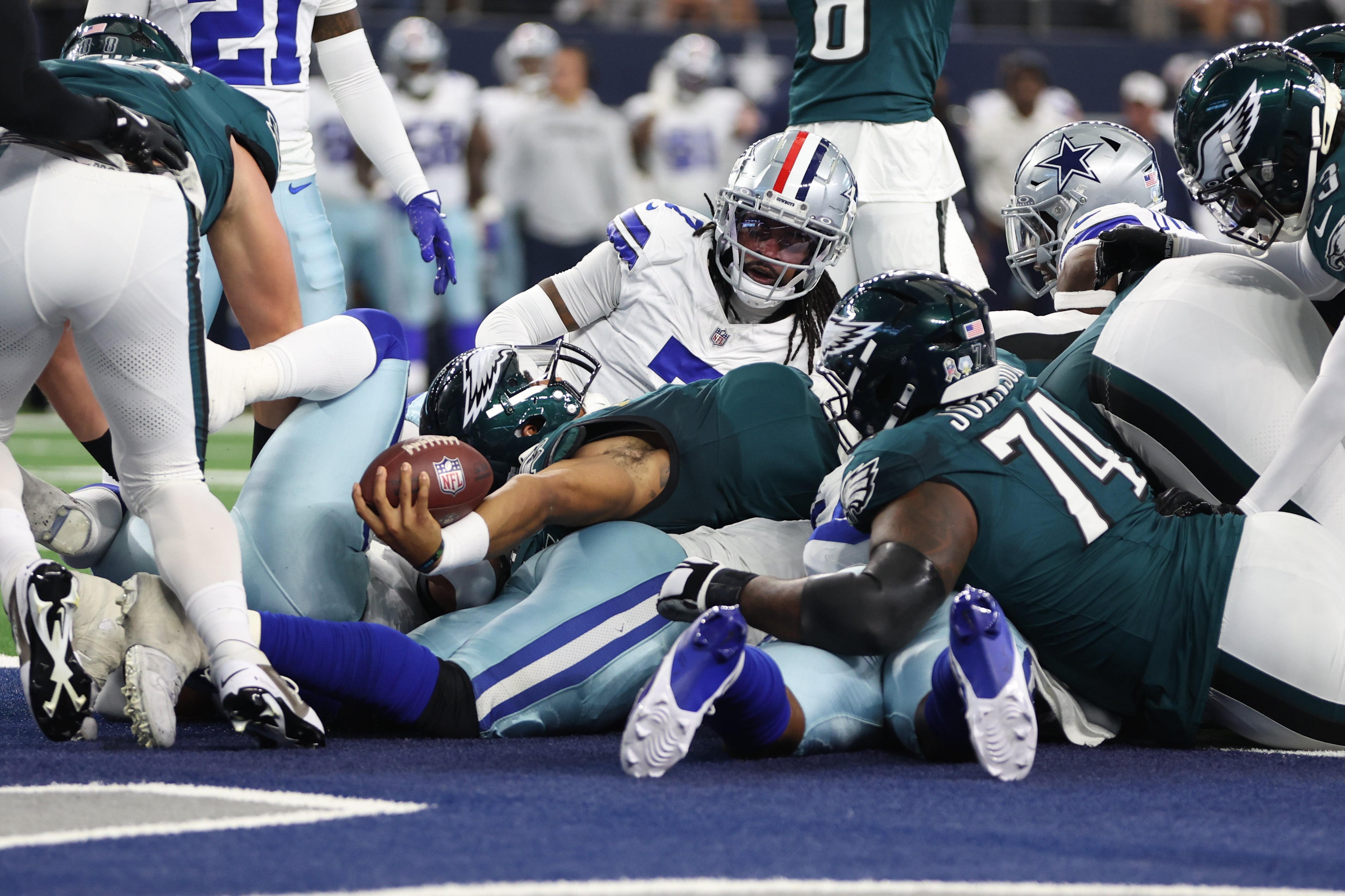 Philadelphia Eagles quarterback Jalen Hurts (1) scores a touchdown in the first quarter against the Dallas Cowboys at AT&T Stadium.