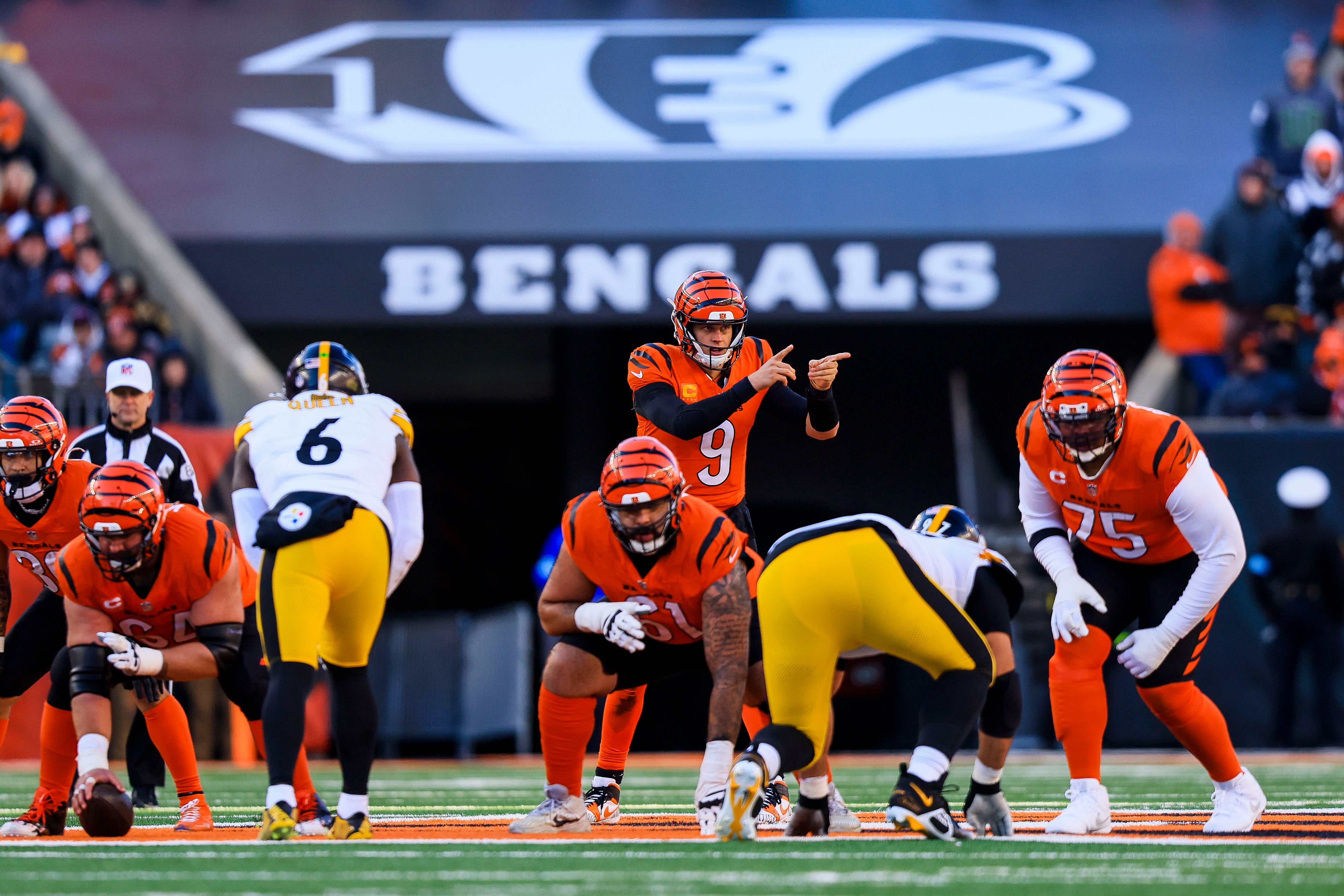 Dec 1, 2024; Cincinnati, Ohio, USA; Cincinnati Bengals quarterback Joe Burrow (9) prepares to snap the ball against the Pittsburgh Steelers in the second half at Paycor Stadium.