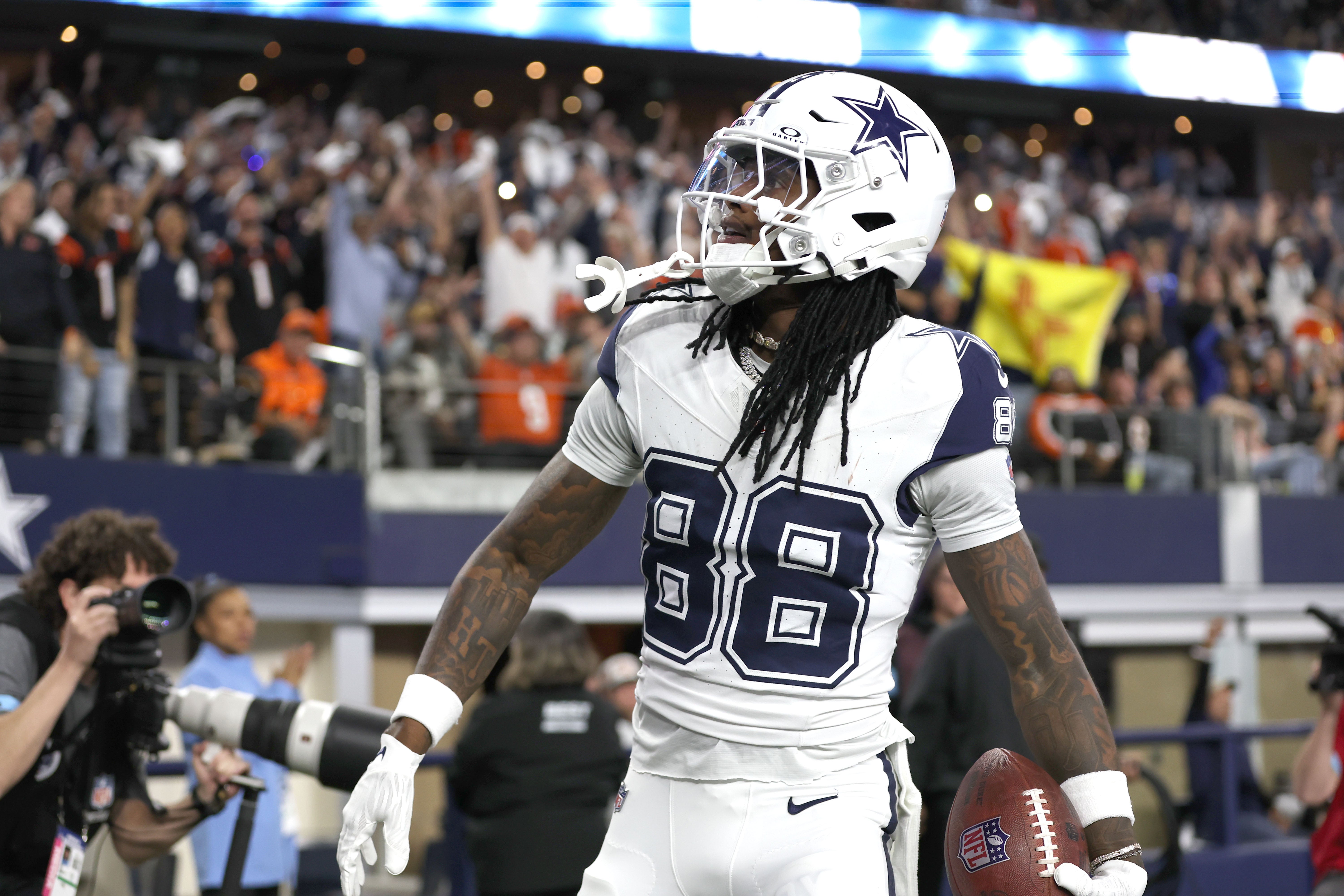 Dallas Cowboys wide receiver CeeDee Lamb (88) reacts after scoring a touchdown against the Cincinnati Bengals in the first quarter at AT&T Stadium.