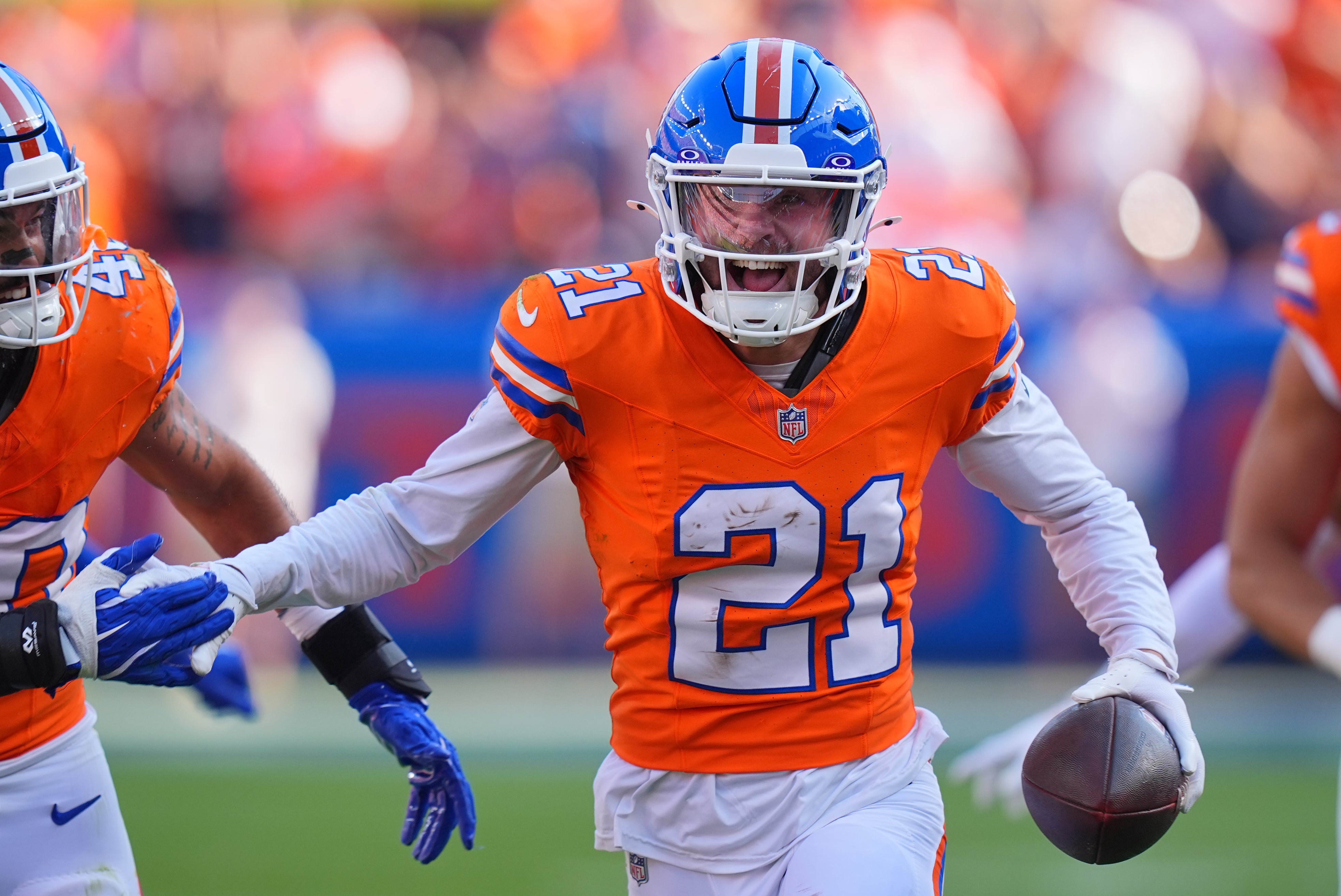 Broncos cornerback Riley Moss (21) celebrates his interception in the second half against the Raiders.
