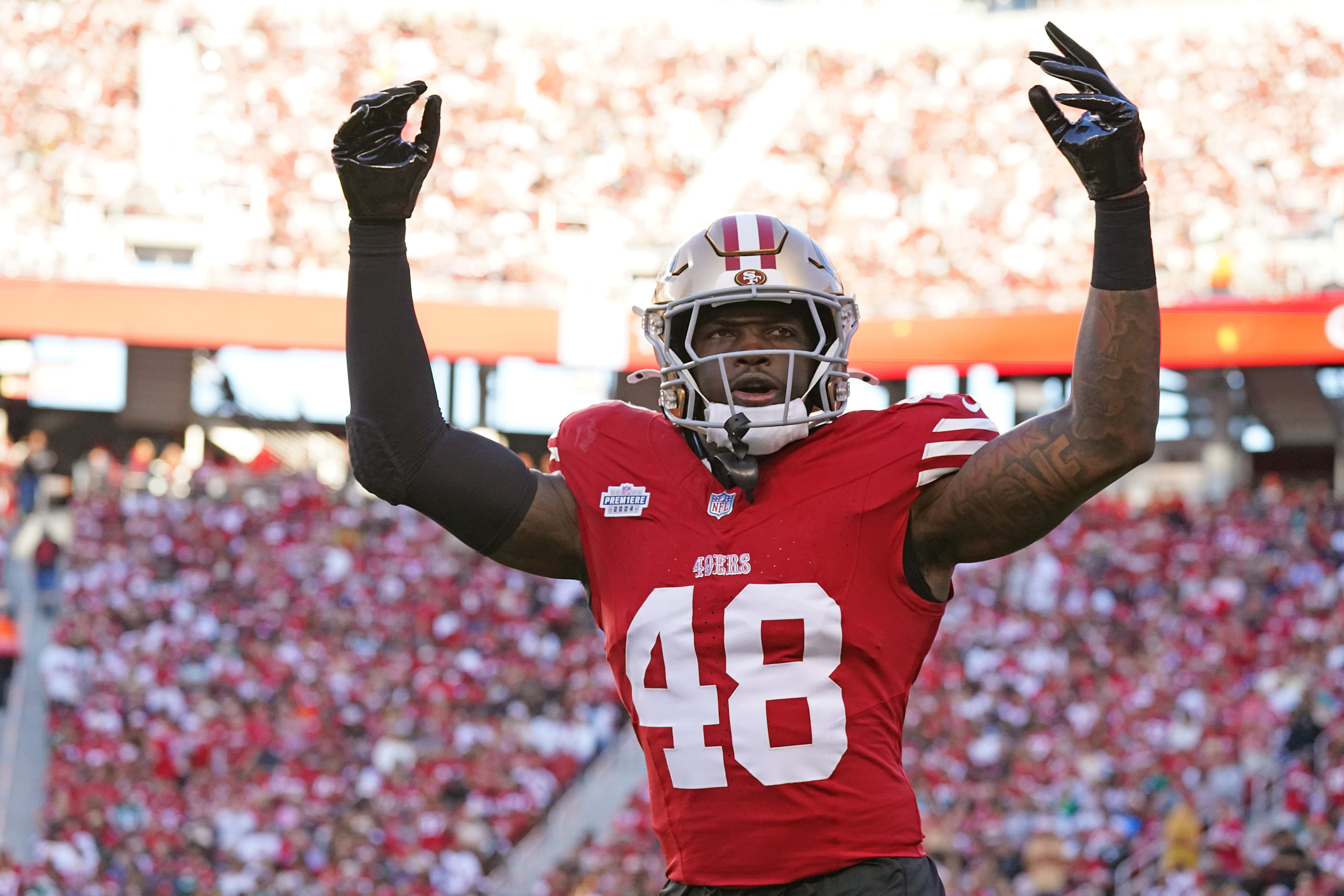 San Francisco 49ers linebacker Tatum Bethune (48) jogs off the field and rallies the crowd in the second quarter against the New York Jets at Levi's Stadium.
