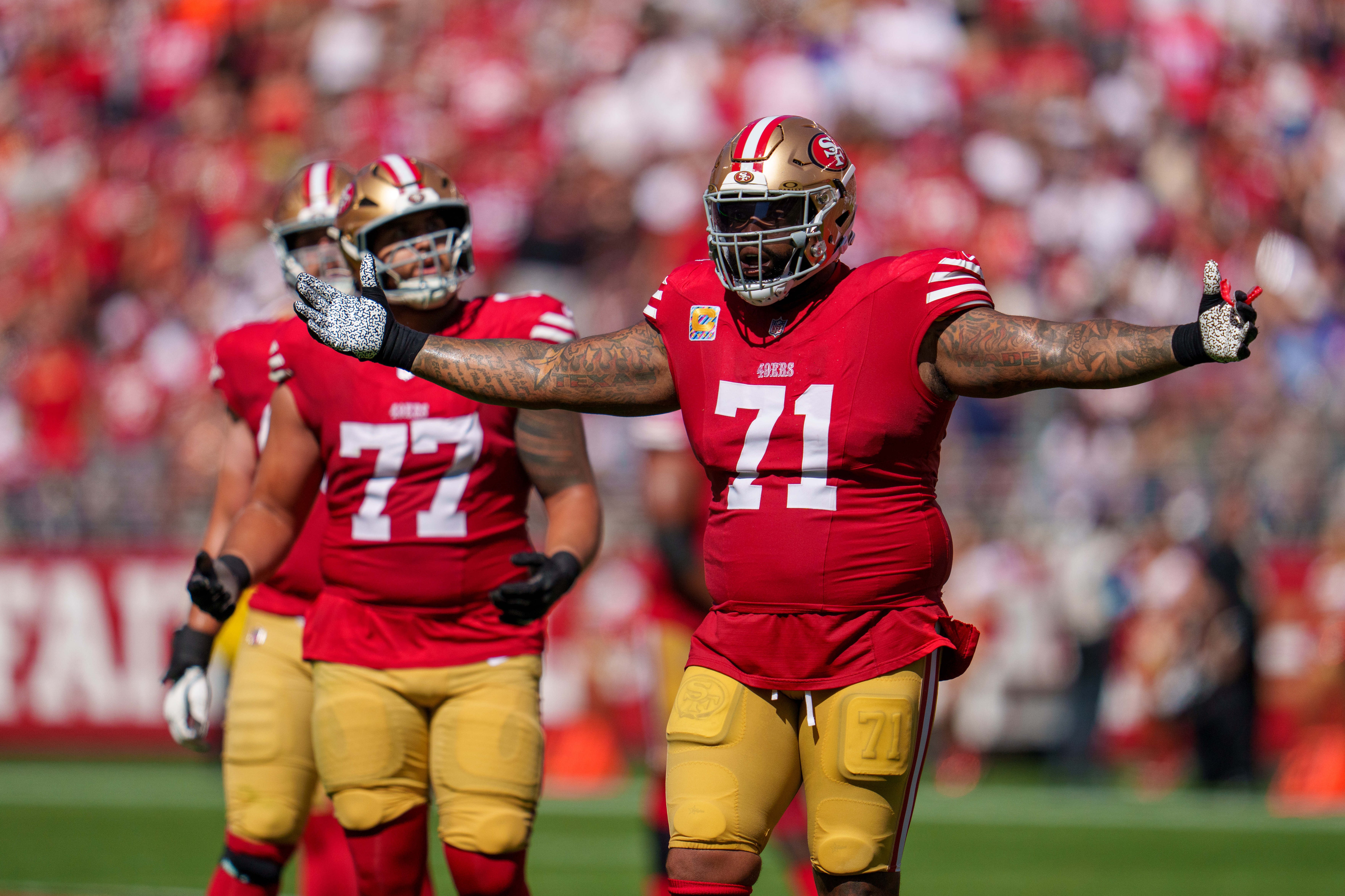 San Francisco 49ers offensive tackle Trent Williams (71) reacts after a foul negates a touchdown against the New England Patriots during the second quarter at Levi's Stadium.