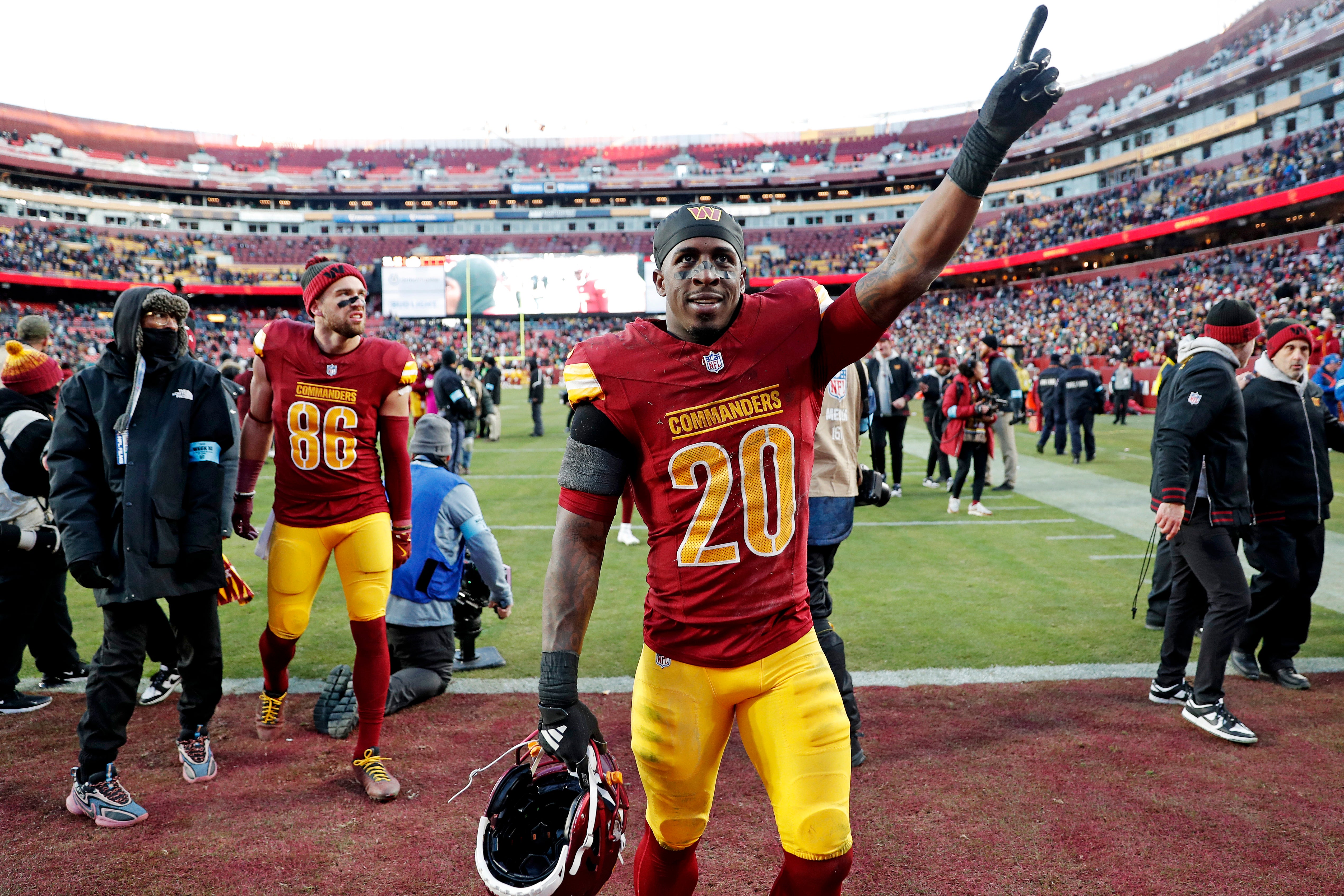 Dec 22, 2024; Landover, Maryland, USA; Washington Commanders safety Quan Martin (20) celebrates after the Washington Commanders beat the Philadelphia Eagles at Northwest Stadium.