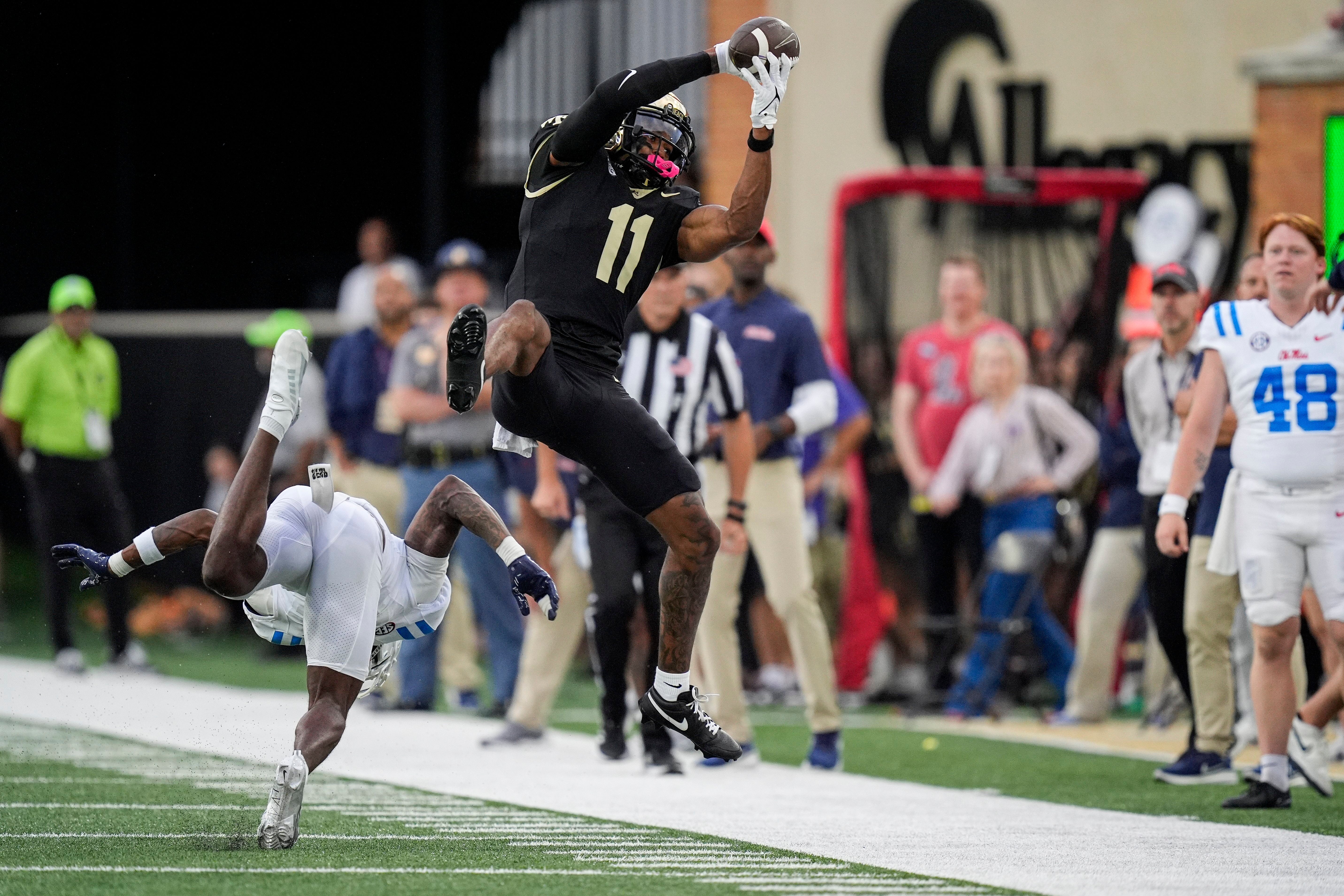 Wake Forest Demon Deacons wide receiver Donavon Greene (11) grabs a reception against the Mississippi Rebels during the first half at Allegacy Federal Credit Union Stadium.
