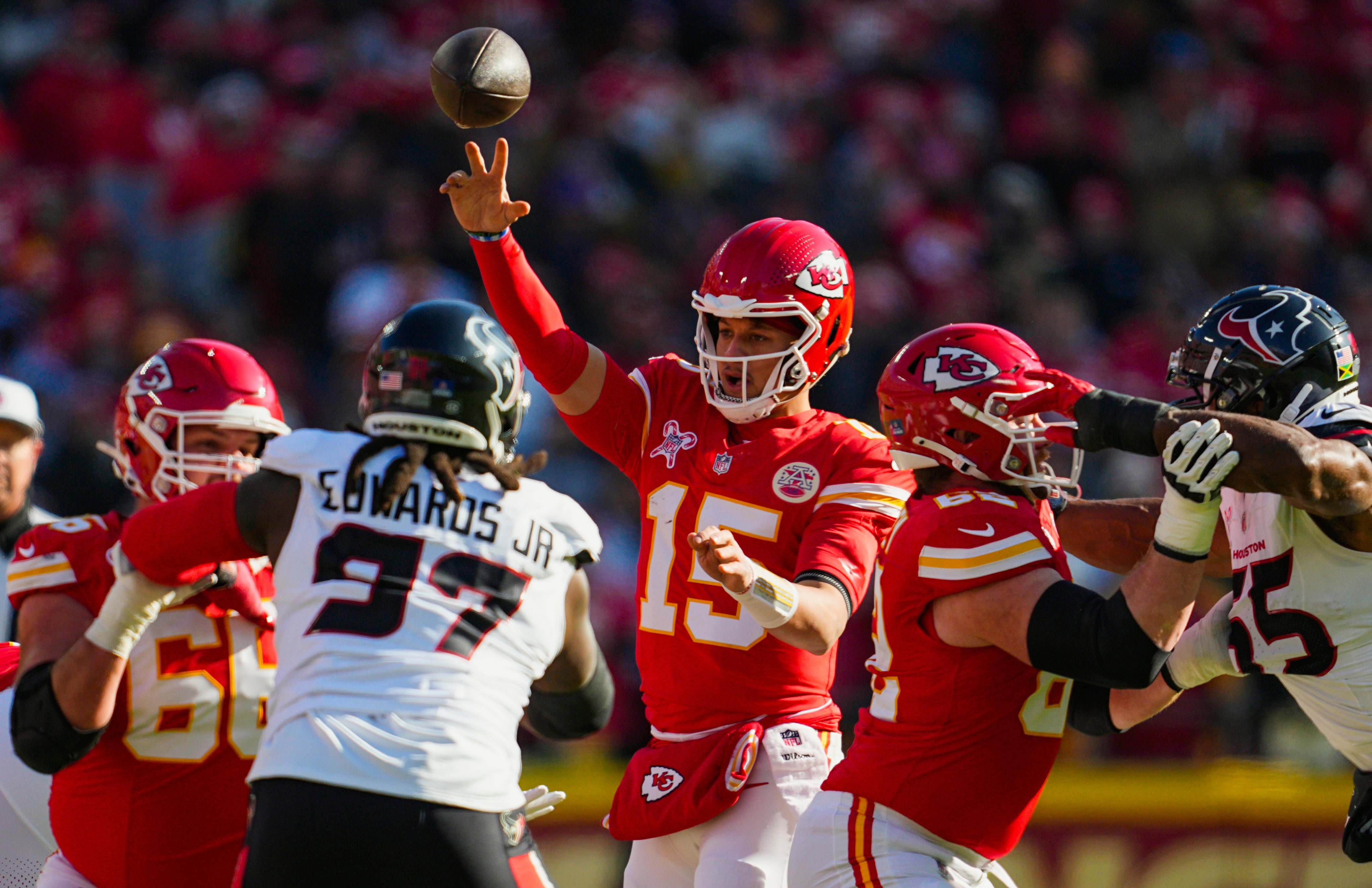 Dec 21, 2024; Kansas City, Missouri, USA; Kansas City Chiefs quarterback Patrick Mahomes (15) throws a pass during the first half against the Houston Texans at GEHA Field at Arrowhead Stadium.