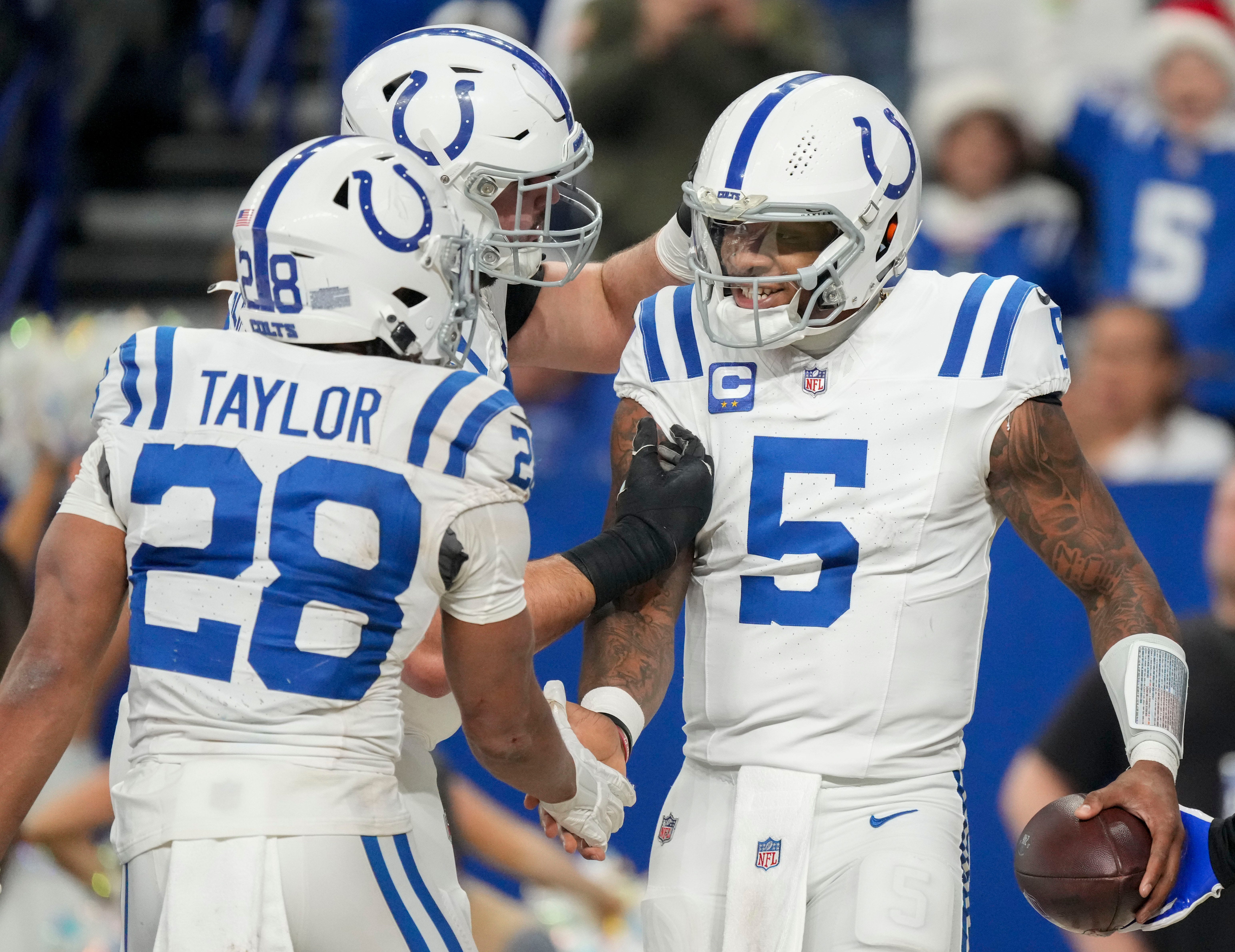 Indianapolis Colts quarterback Anthony Richardson (5) celebrates with teammates after rushing for a touchdown Sunday, Dec. 22, 2024, during a game against the Tennessee Titans at Lucas Oil Stadium in Indianapolis.