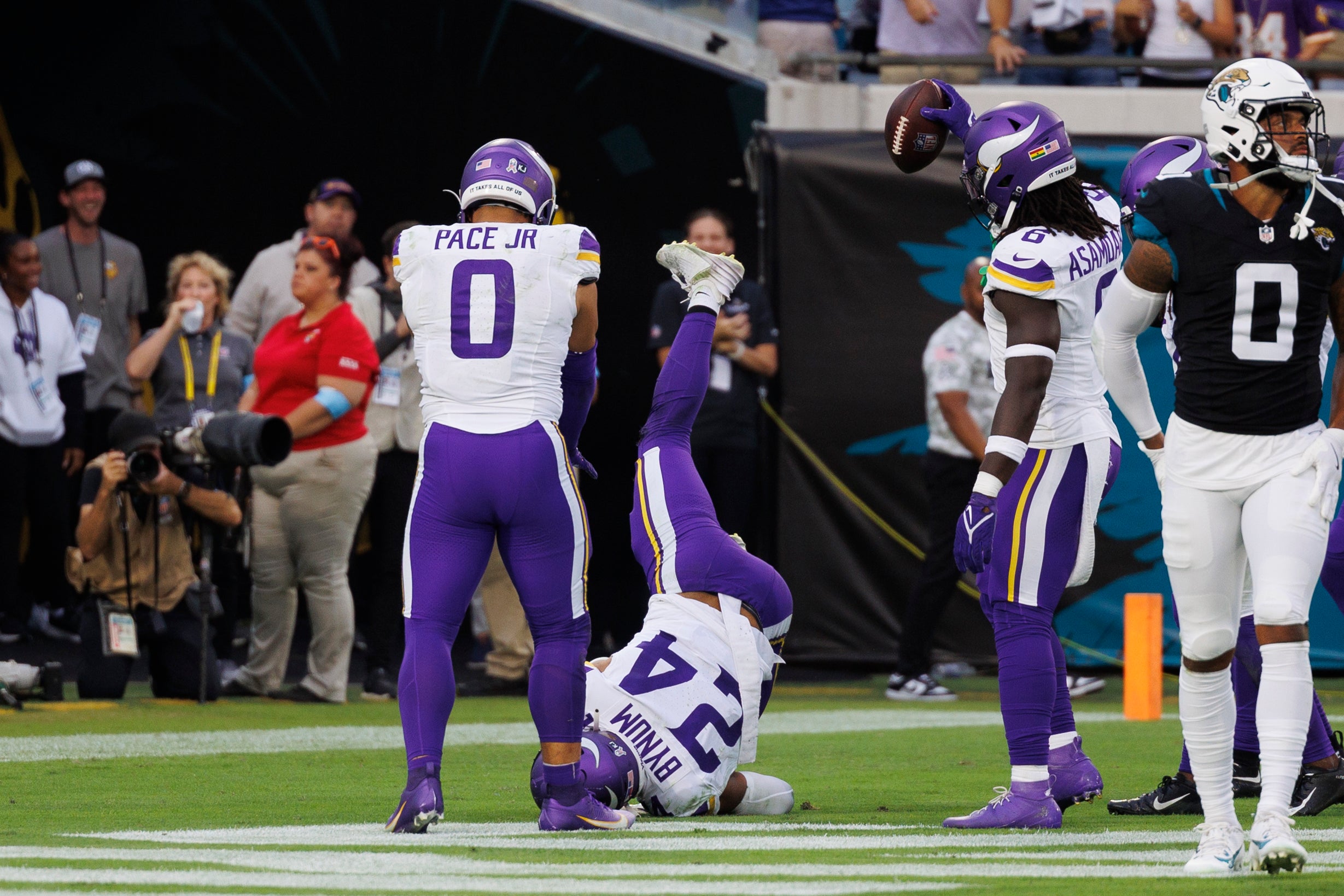 Nov 10, 2024; Jacksonville, Florida, USA; Minnesota Vikings safety Camryn Bynum (24) celebrates an interception with linebacker Ivan Pace Jr. (0), and linebacker Brian Asamoah II (6) against the Jacksonville Jaguars during the third quarter at EverBank Stadium.