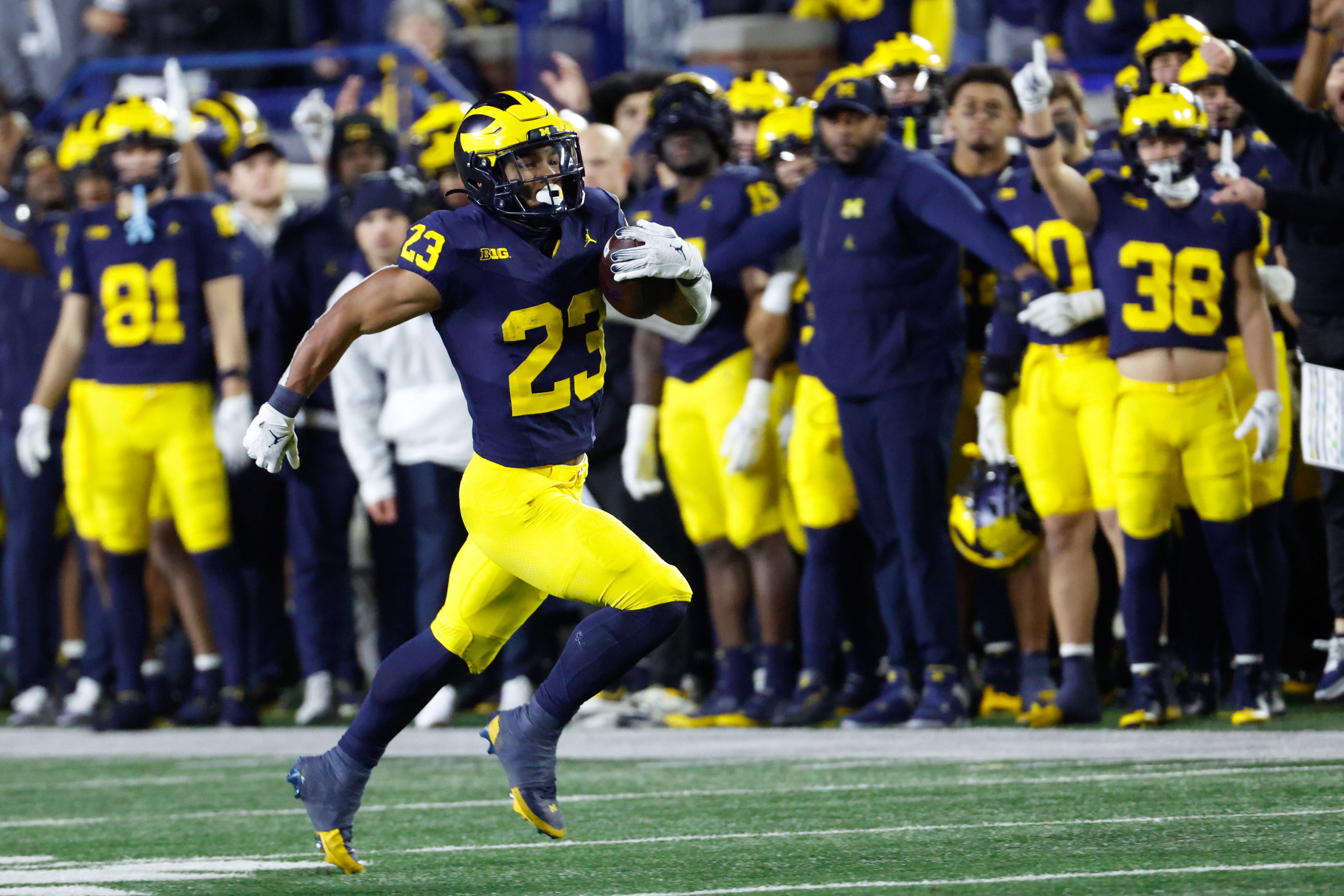 Nov 23, 2024; Ann Arbor, Michigan, USA; Michigan Wolverines running back Jordan Marshall (23) runs the ball on a kick off return in the second half against the Northwestern Wildcats at Michigan Stadium