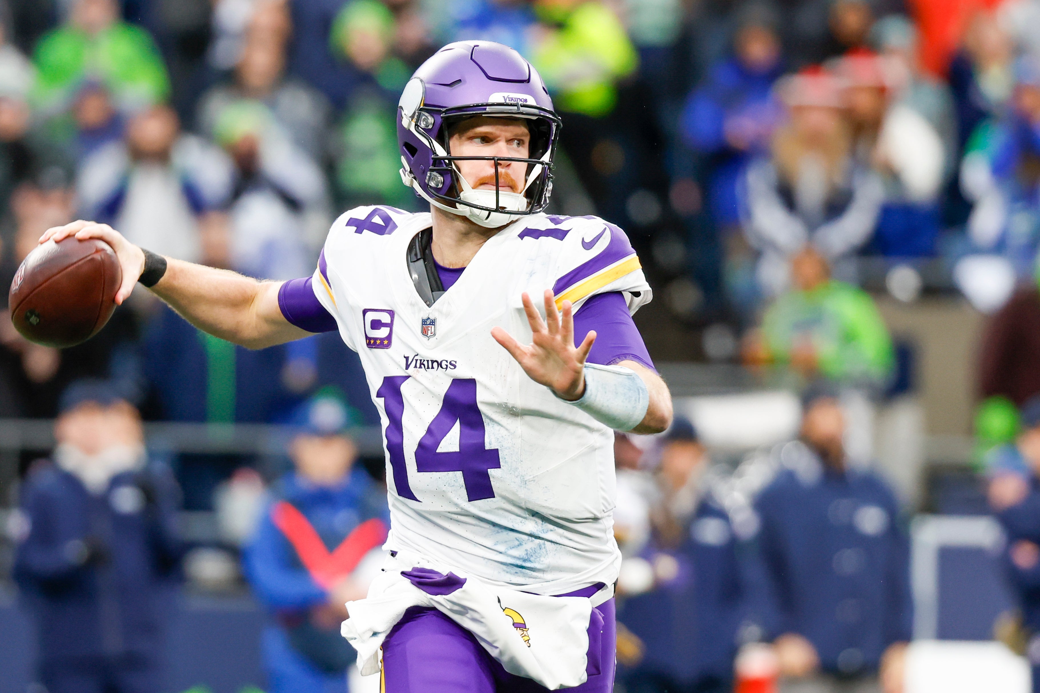 Dec 22, 2024; Seattle, Washington, USA; Minnesota Vikings quarterback Sam Darnold (14) passes against the Seattle Seahawks during the third quarter at Lumen Field.