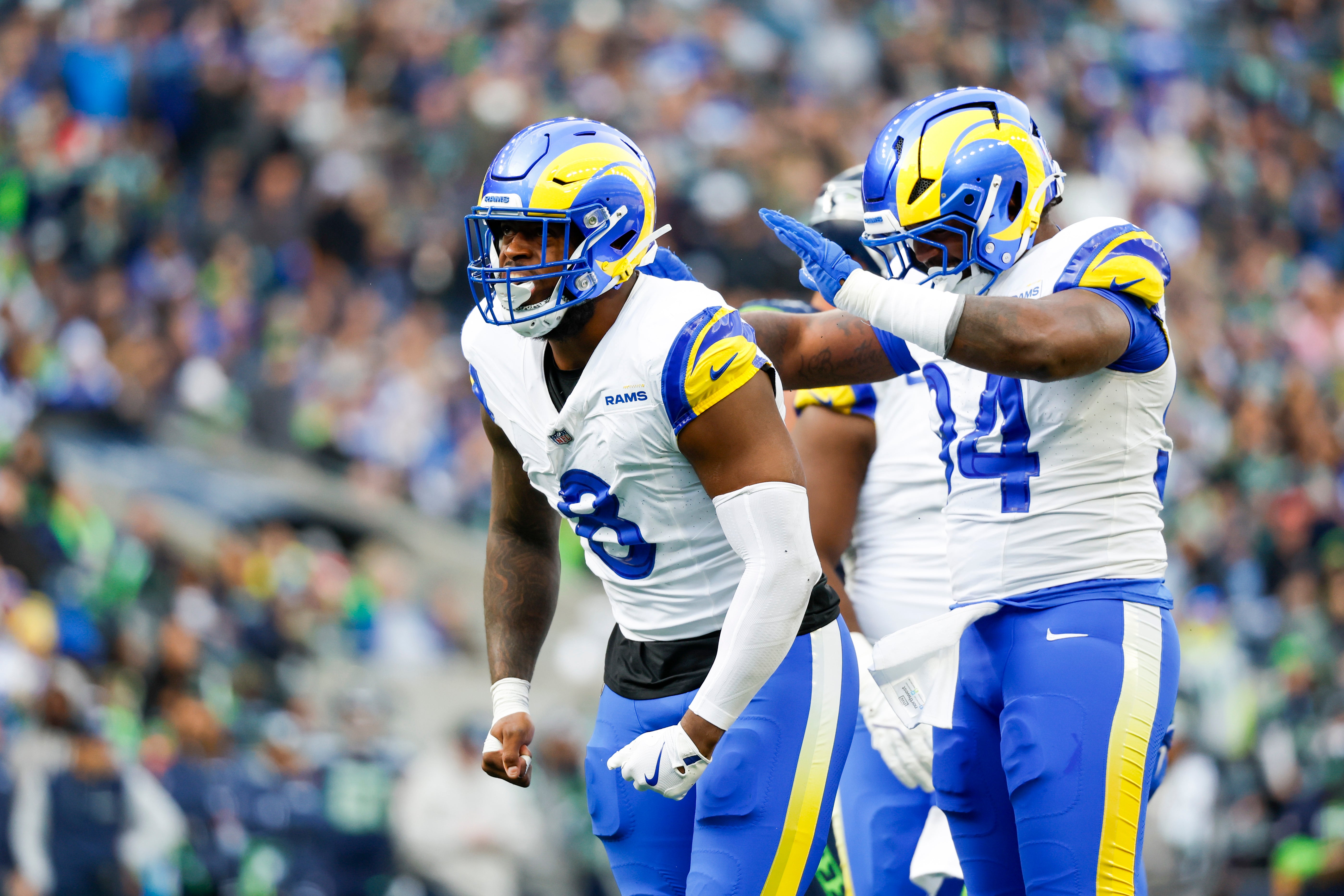 Nov 3, 2024; Seattle, Washington, USA; Los Angeles Rams linebacker Jared Verse (8) celebrates with cornerback Cobie Durant (14) after a sack against the Seattle Seahawks during the second quarter at Lumen Field.