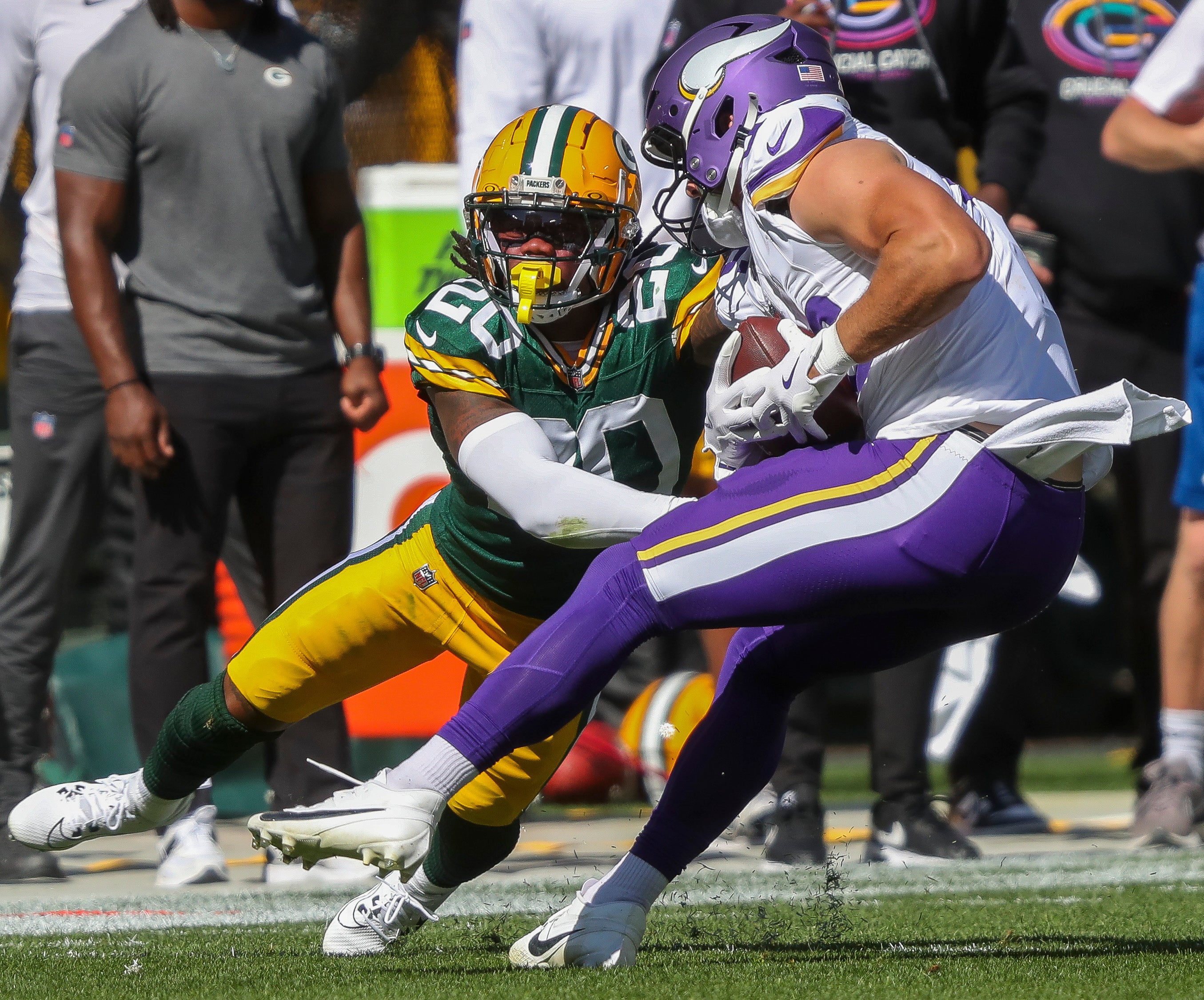 Green Bay Packers safety Javon Bullard (20) misses a tackle against Minnesota Vikings tight end Johnny Mundt (86) at Lambeau Field.