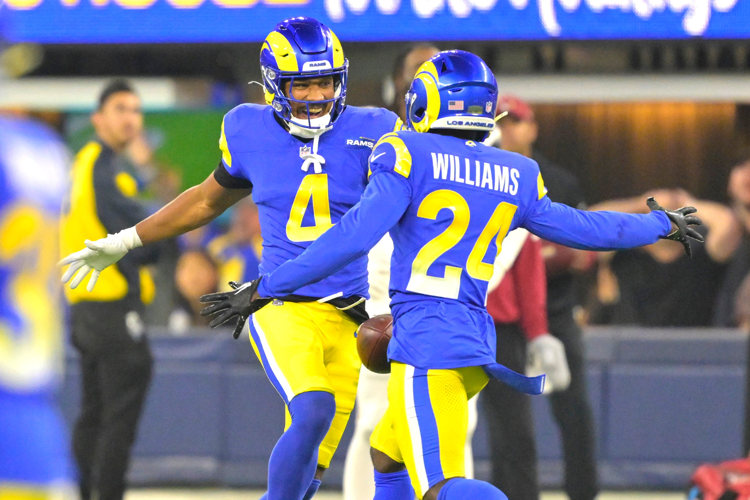 Dec 28, 2024; Inglewood, California, USA; Los Angeles Rams cornerback Ahkello Witherspoon (4) celebrates with cornerback Darious Williams (24) after an interception in the end zone against the Arizona Cardinals in the fourth quarter at SoFi Stadium.