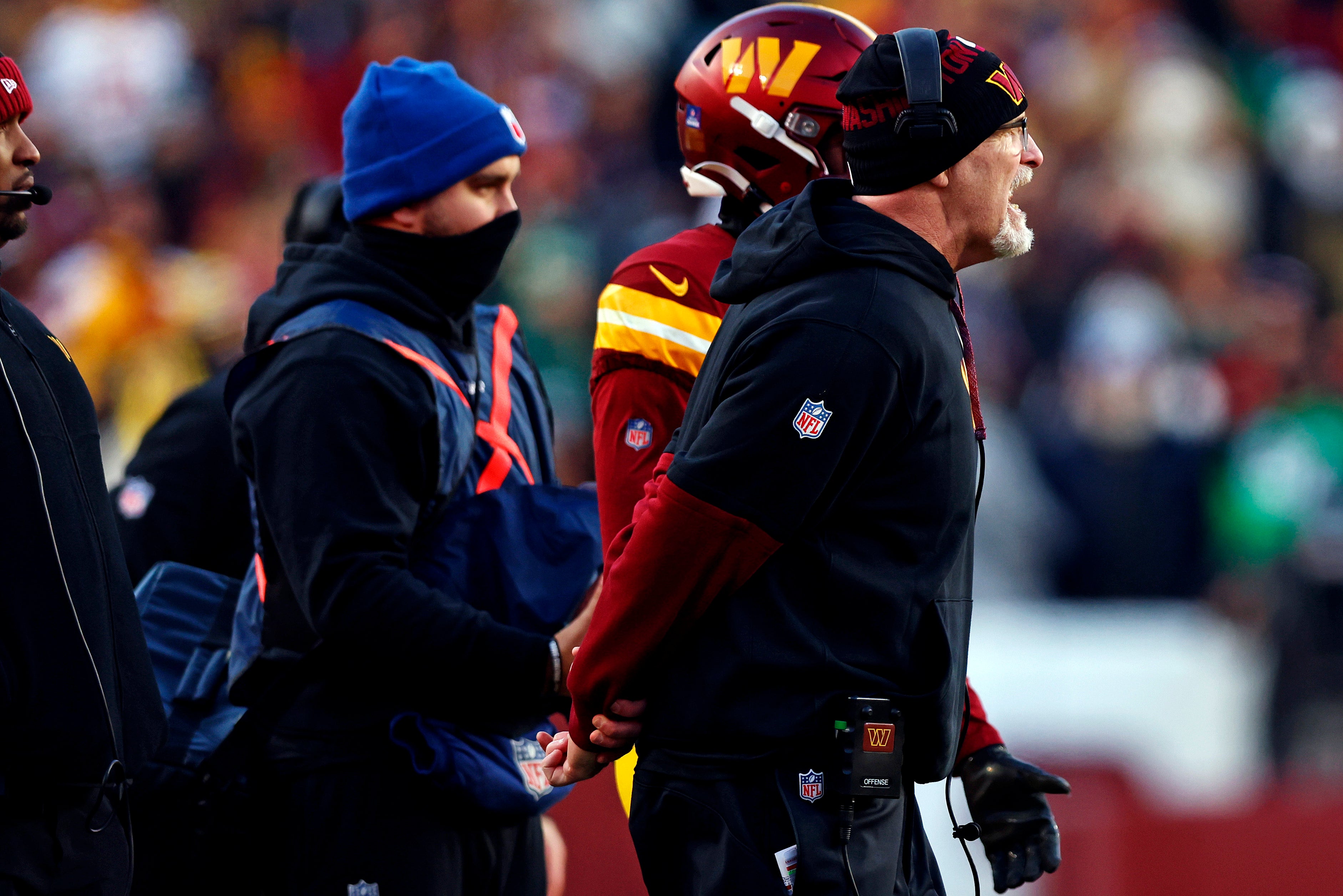 Dec 22, 2024; Landover, Maryland, USA; Washington Commanders head coach reacts to a call during the fourth quarter against the Philadelphia Eagles at Northwest Stadium.
