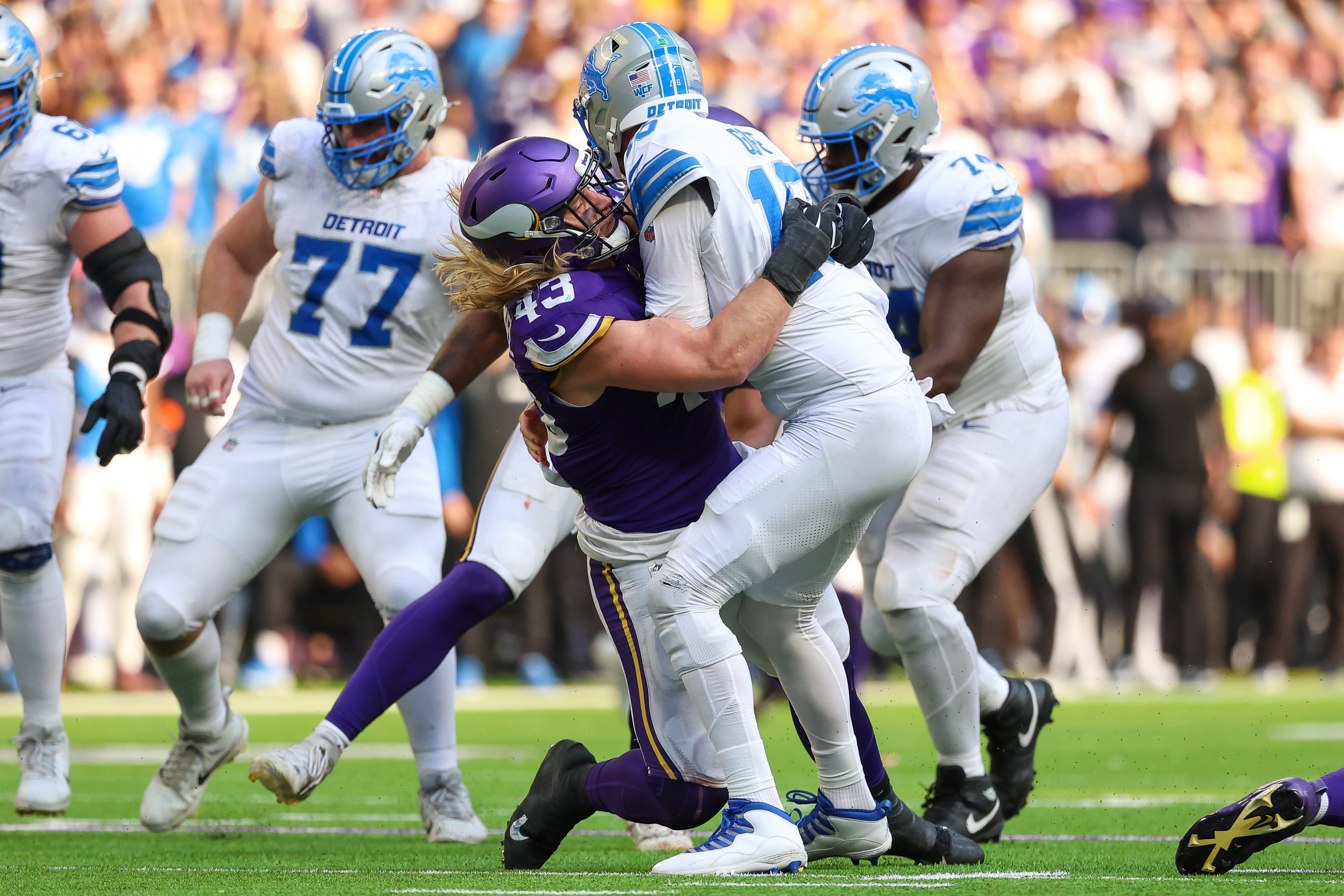 Oct 20, 2024; Minneapolis, Minnesota, USA; Minnesota Vikings linebacker Andrew Van Ginkel (43) tackles Detroit Lions quarterback Jared Goff (16) during the fourth quarter at U.S. Bank Stadium.