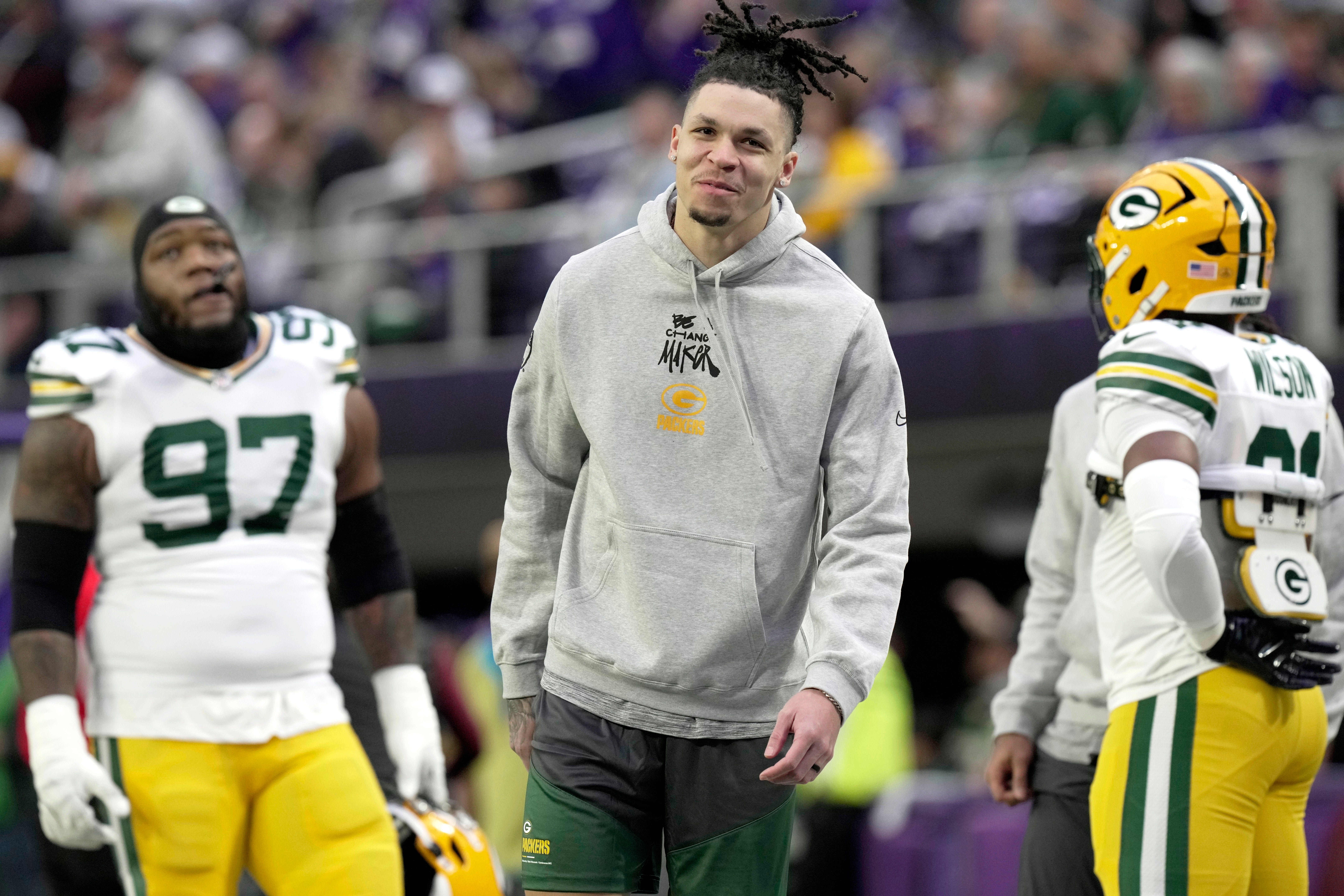 Injured Green Bay Packers wide receiver Christian Watson is shown before their game against the Minnesota Vikings at U.S. Bank Stadium.