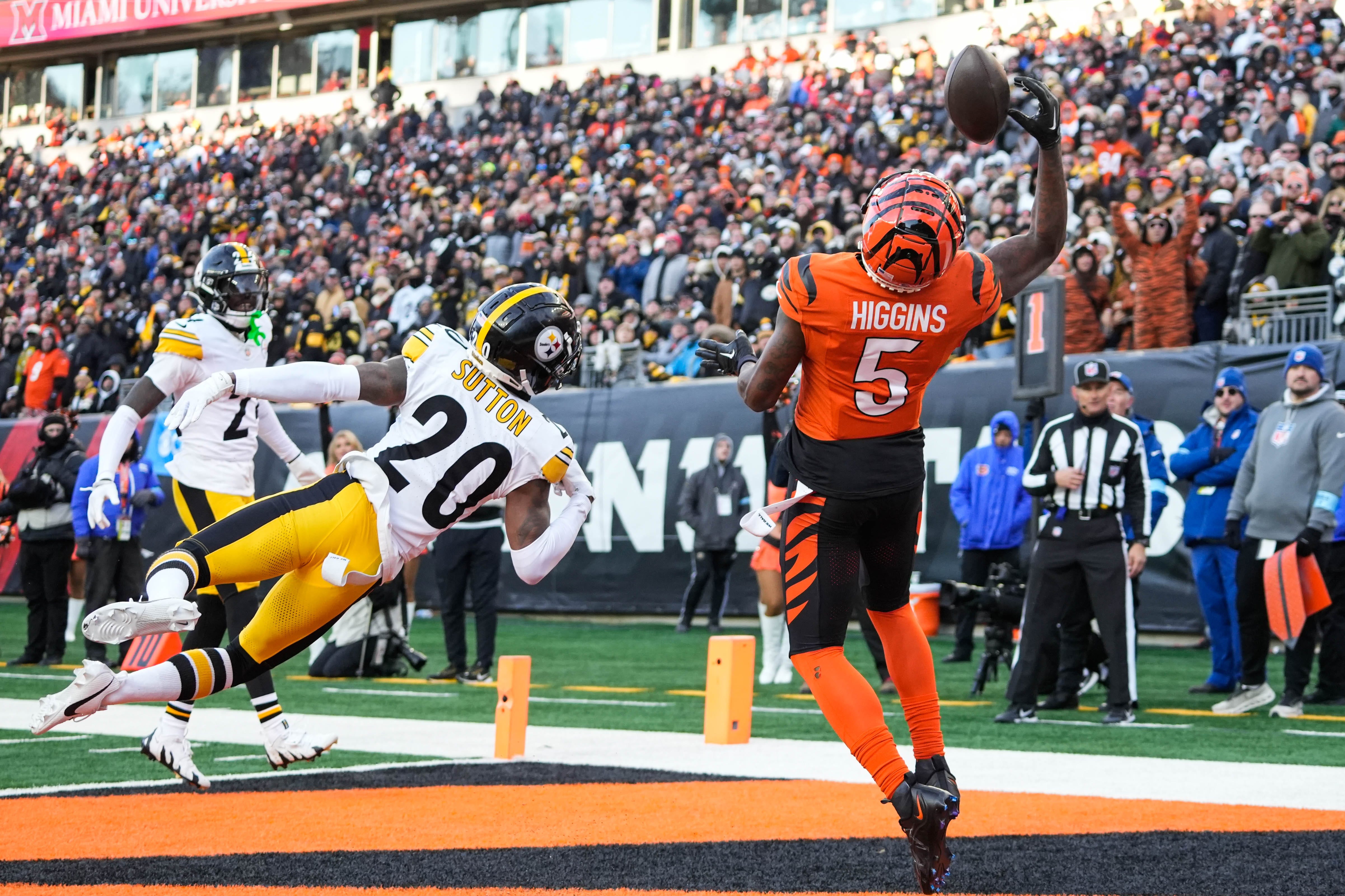 Bengals Tee Higgins (5) leaps to catch the ball but lands out of bounds during their game against the Steelers at Paycor Stadium on Sunday December 1, 2024. Steelers won the game with a final score of 44-38.
