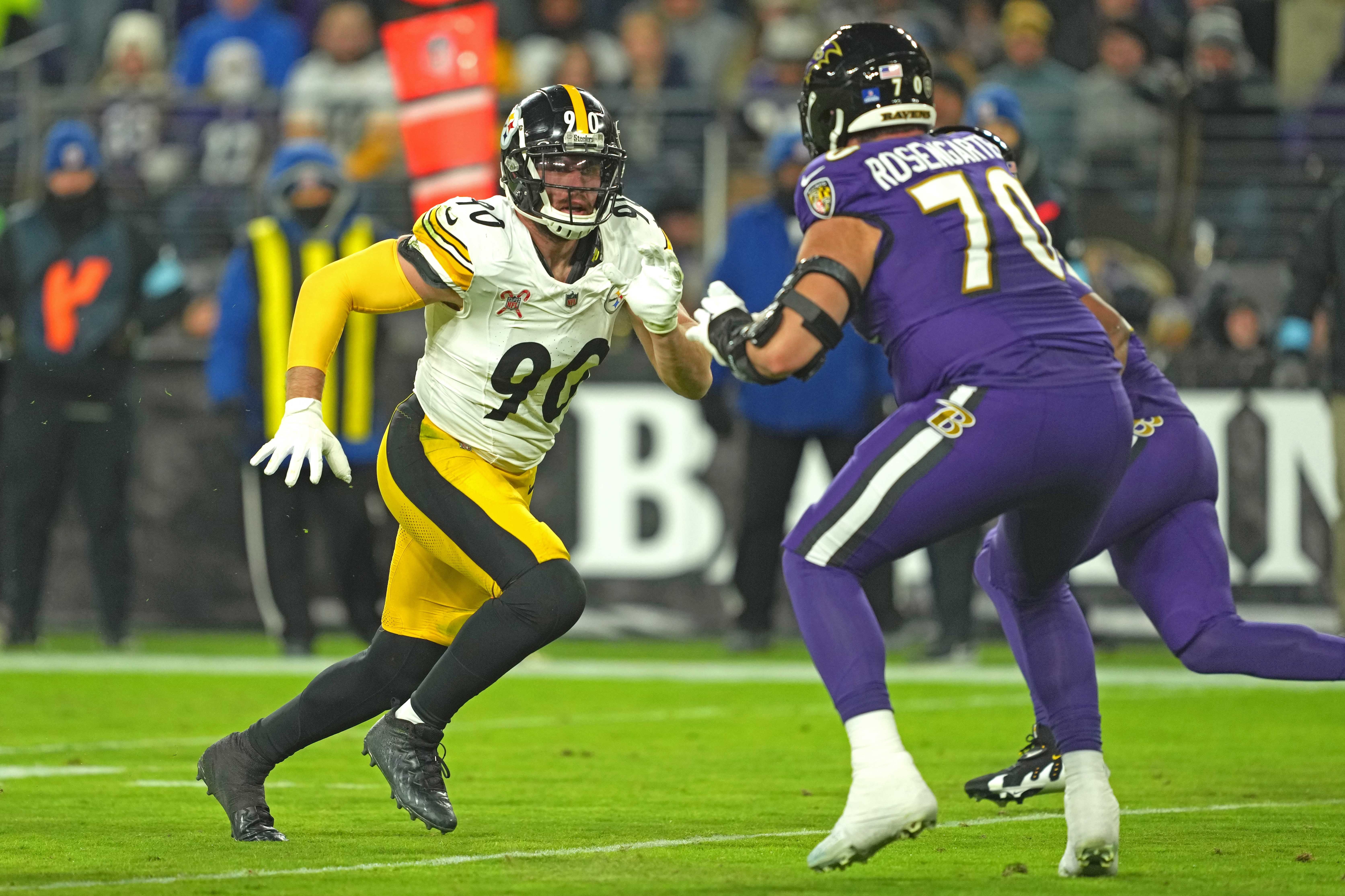 Dec 21, 2024; Baltimore, Maryland, USA; Pittsburgh Steelers linebacker T.J. Watt (90) rushes in the second quarter against Baltimore Ravens tackle Roger Rosengarten (70) at M&T Bank Stadium.