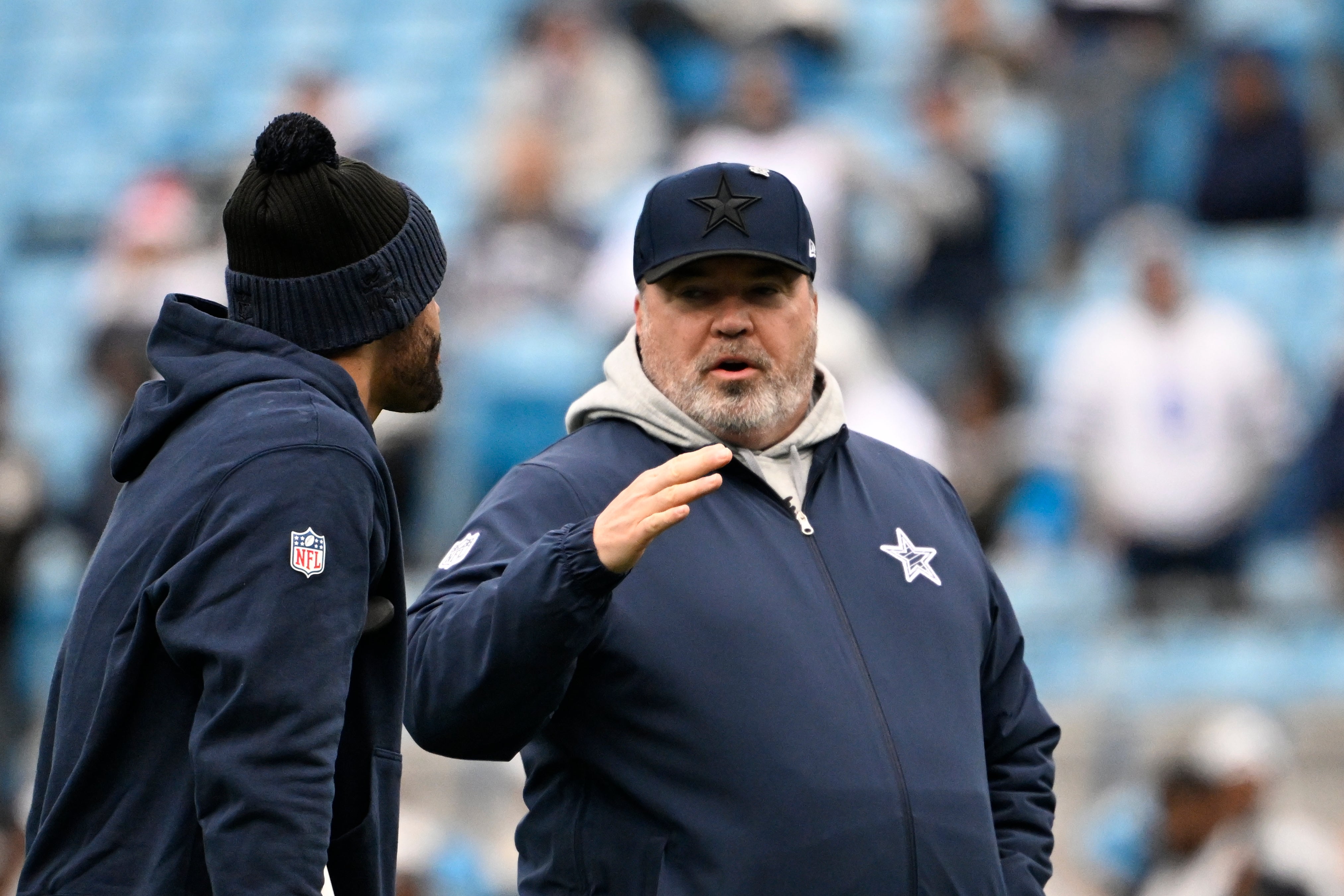 Dallas Cowboys head coach Mike McCarthy with quarterback Dak Prescott (4) before the game at Bank of America Stadium.