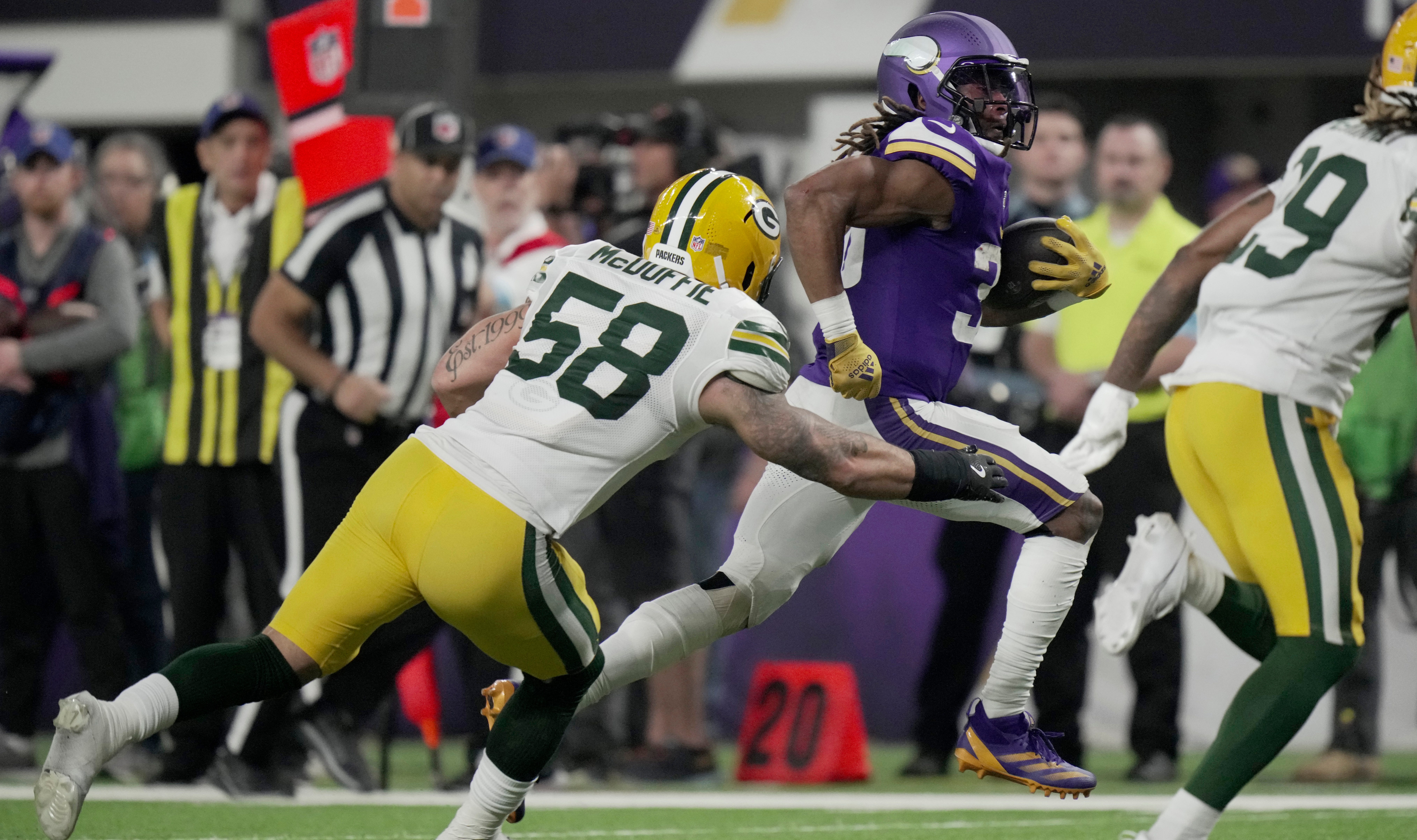 Minnesota Vikings running back Aaron Jones (33) bursts though the Green Bay Packers defense during the fourth quarter of their game Sunday, December 29, 2024 at U.S. Bank Stadium in Minneapolis, Minnesota. The Minnesota Vikings beat the Green Bay Packers 27-25.