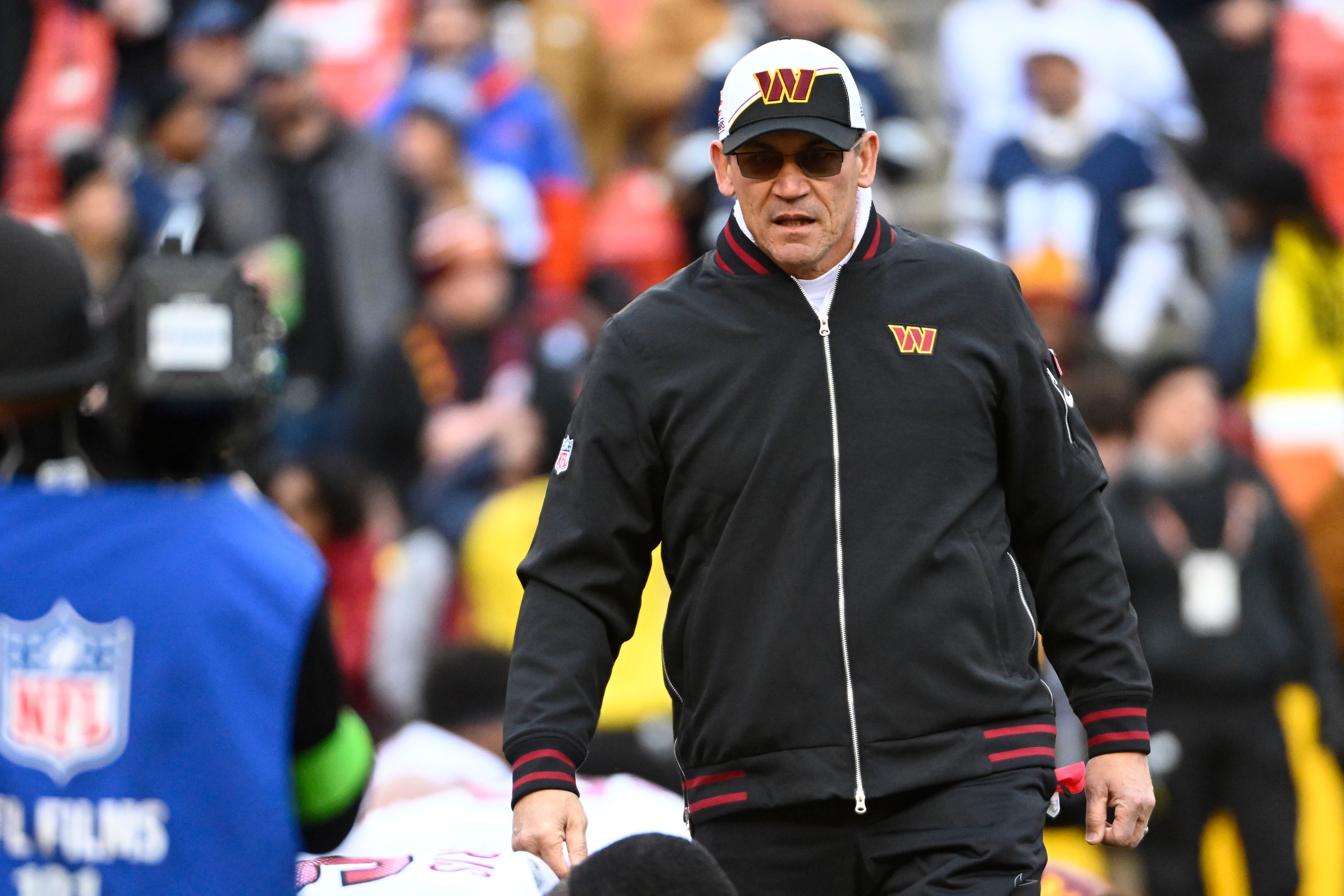 Washington Commanders head coach Ron Rivera on the field before the game against the Dallas Cowboys at FedExField.