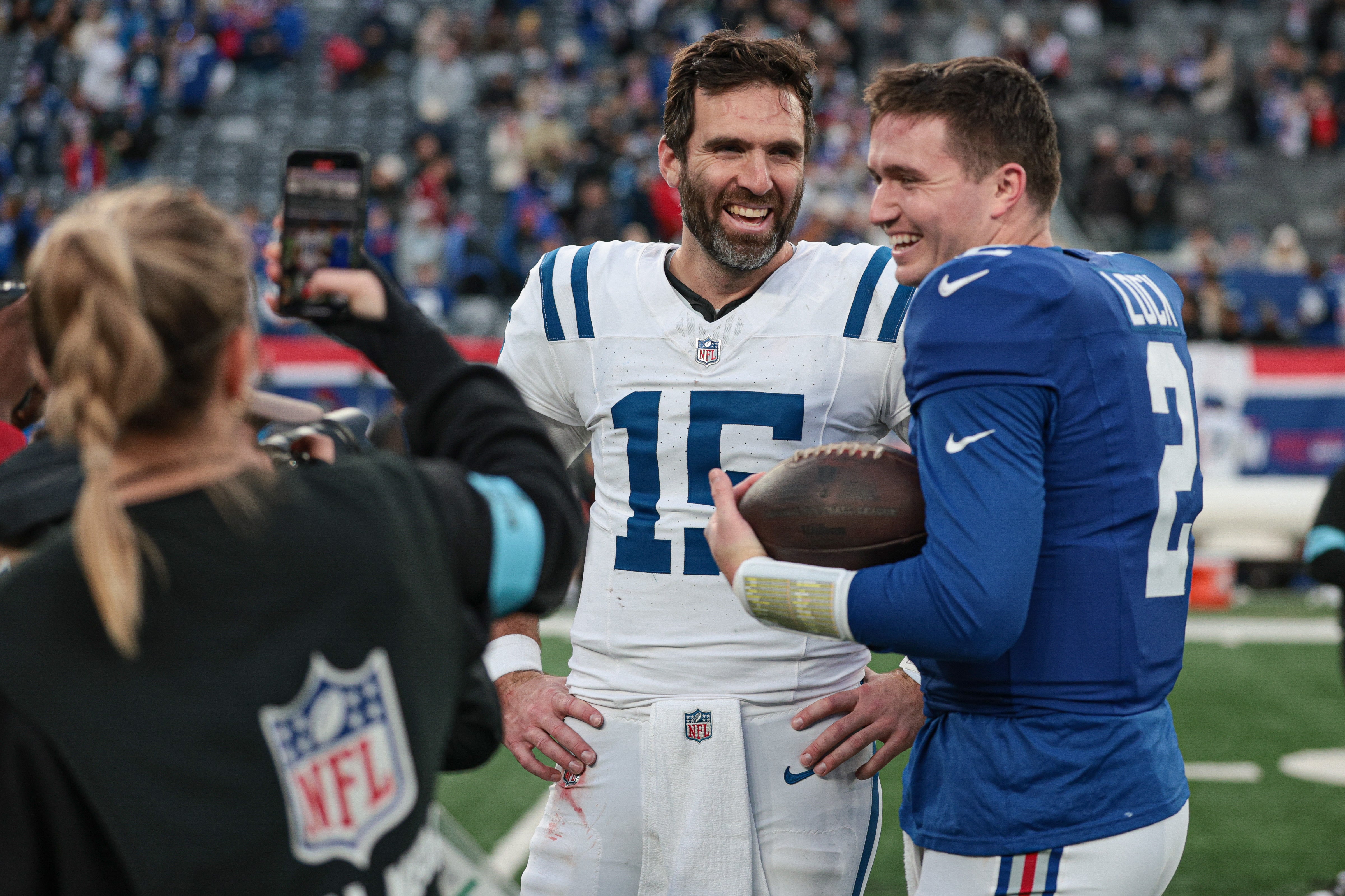 Indianapolis Colts quarterback Joe Flacco (15) and New York Giants quarterback Drew Lock (2) talk after the game at MetLife Stadium. Vincent Carchietta-Imagn Images