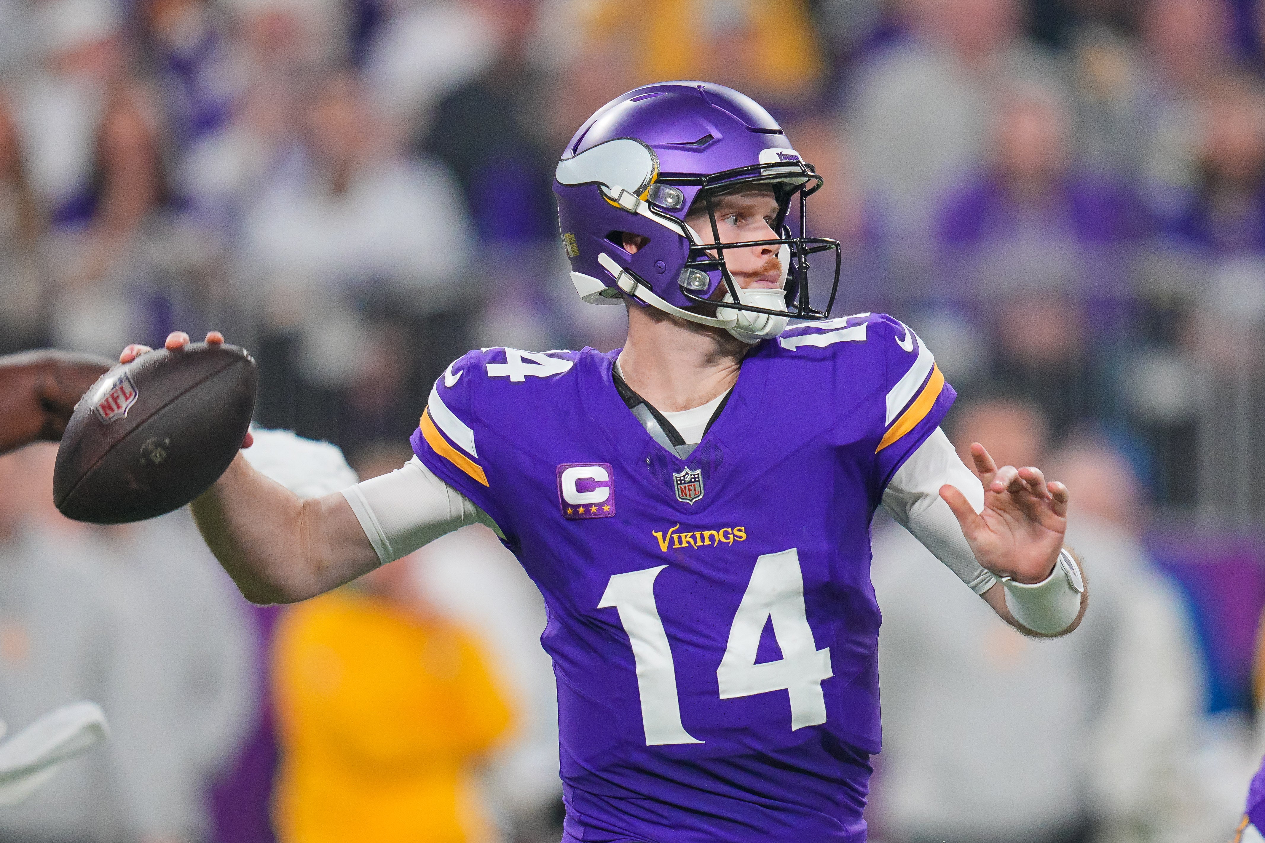 Dec 29, 2024; Minneapolis, Minnesota, USA; Minnesota Vikings quarterback Sam Darnold (14) passes against Green Bay Packers in the second quarter at U.S. Bank Stadium.