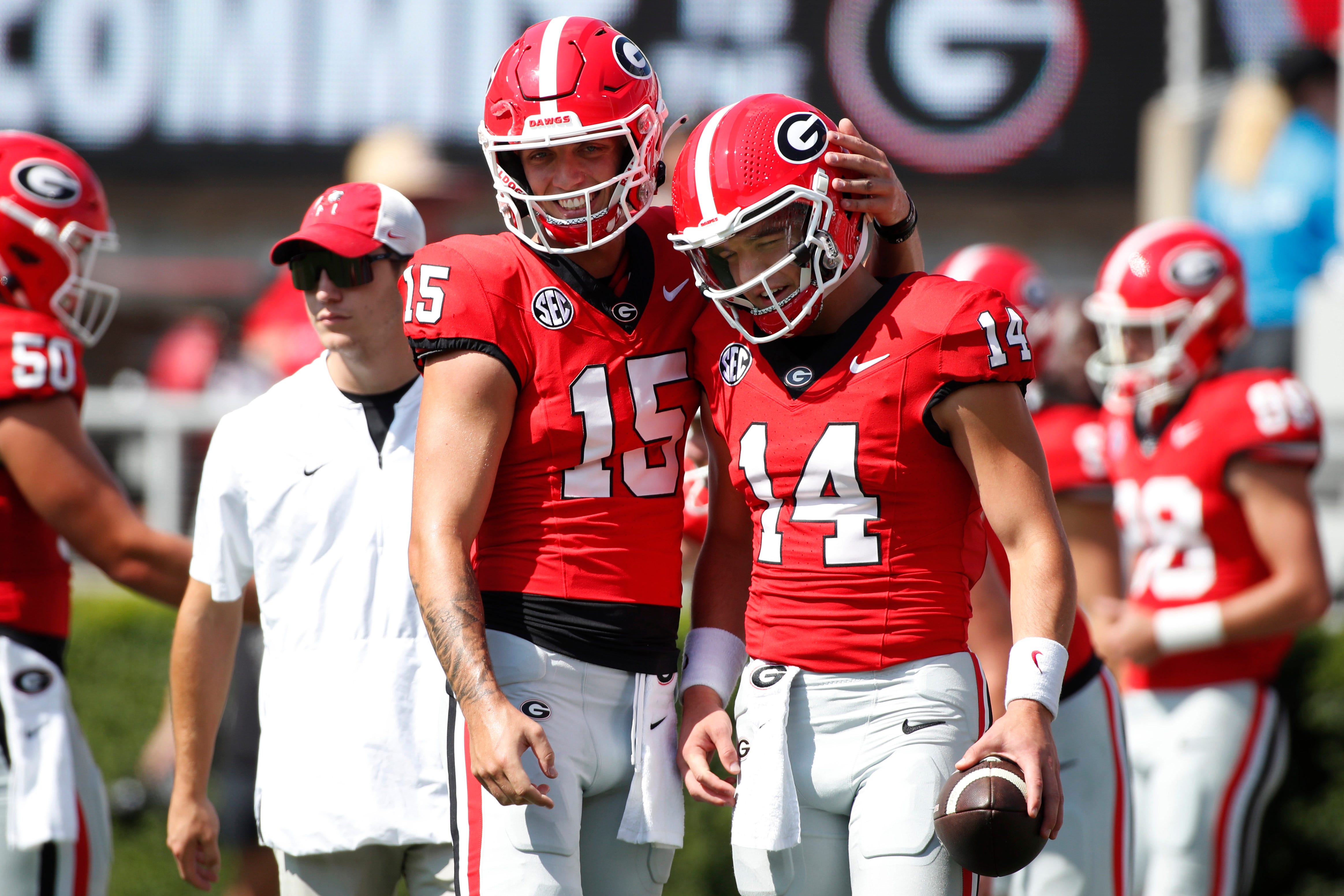 Georgia quarterback Carson Beck (15) and Georgia quarterback Gunner Stockton (14) get ready before the start of a NCAA college football game against Ball State in Athens, Ga., on Saturday, Sept. 9, 20...