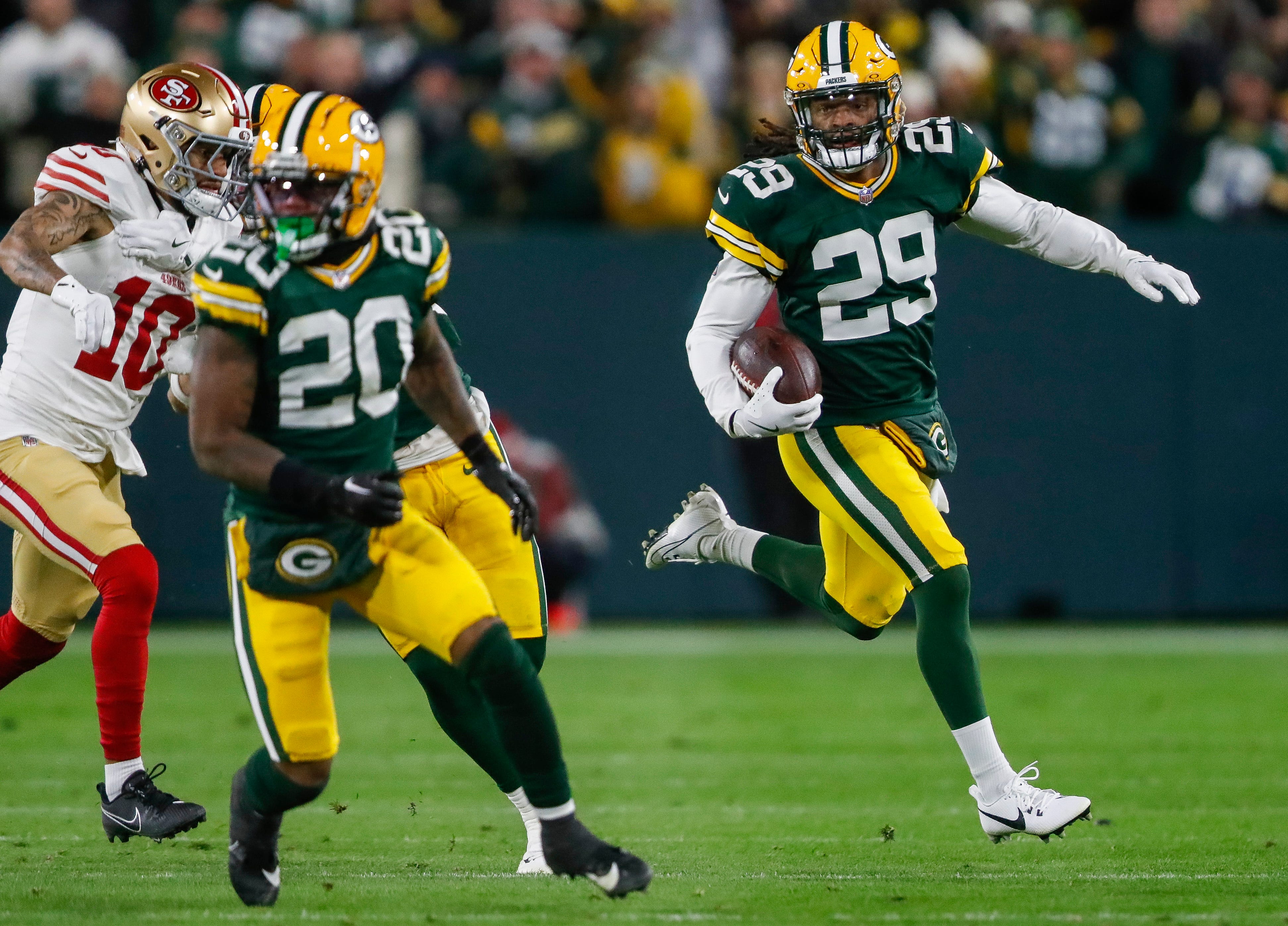 Green Bay Packers safety Xavier McKinney (29) returns an interception against the San Francisco 49ers on Sunday, November 24, 2024, at Lambeau Field in Green Bay, Wis. The Packers won the game, 38-10.