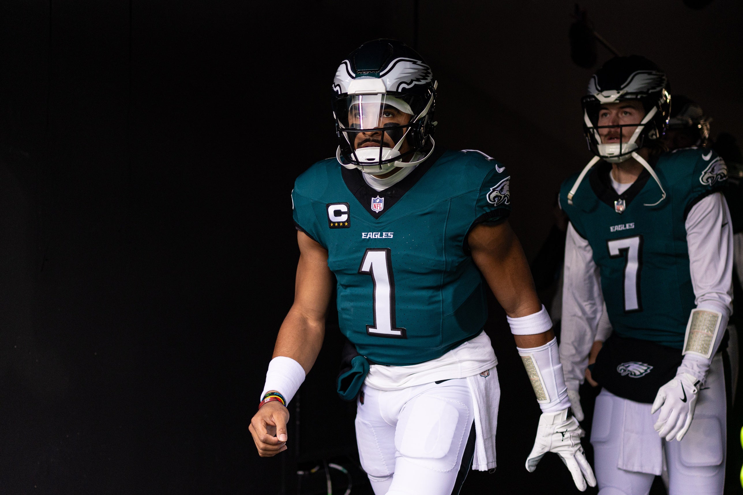 Philadelphia Eagles quarterback Jalen Hurts (1) and quarterback Kenny Pickett (7) take the field for warm ups against the Pittsburgh Steelers at Lincoln Financial Field.