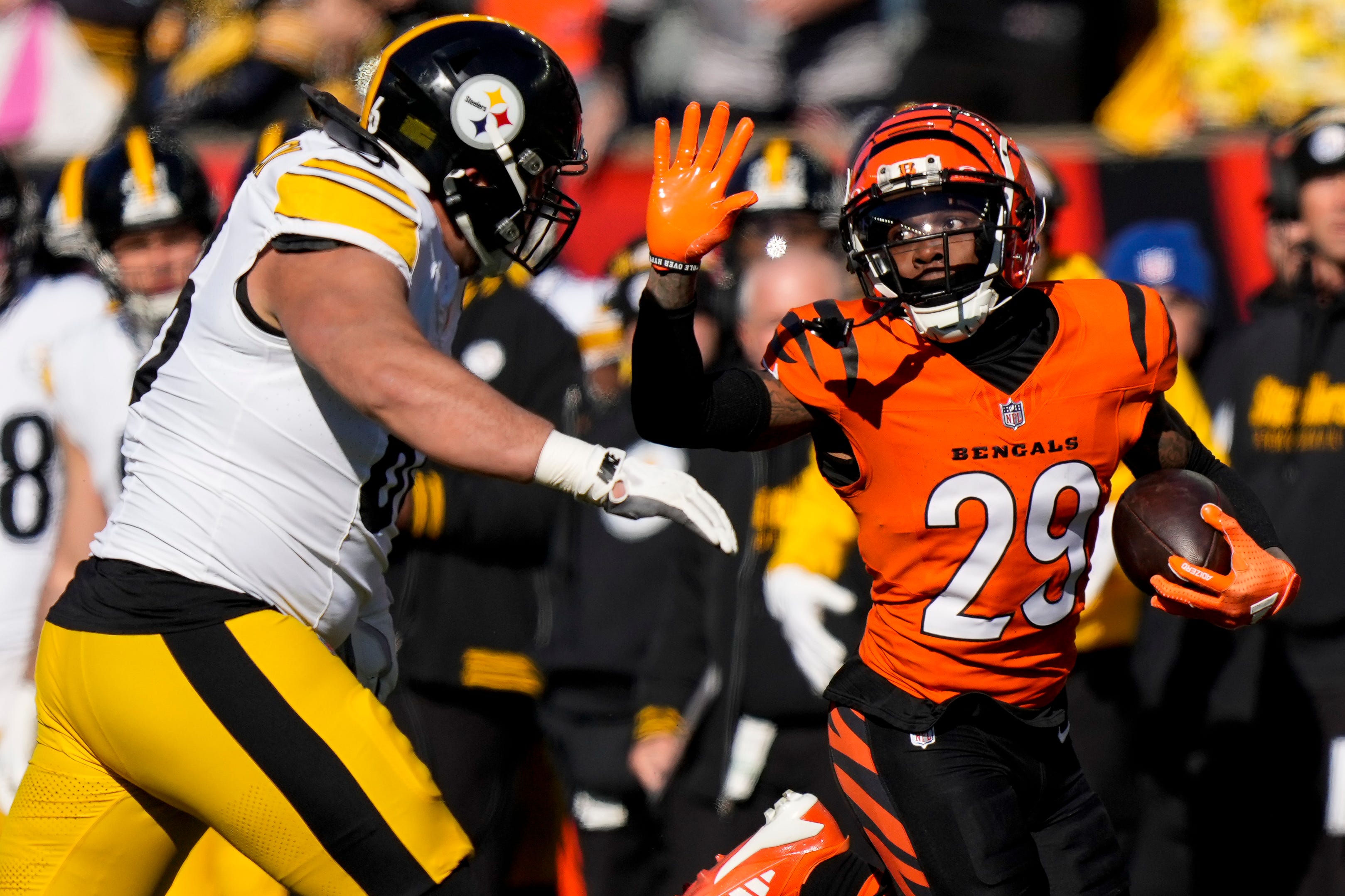 Cincinnati Bengals cornerback Cam Taylor-Britt (29) runs back an interception for a touchdown in the first quarter of the NFL Week 13 game between the Cincinnati Bengals and the Pittsburgh Steelers at Paycor Stadium in downtown Cincinnati on Sunday, Dec. 1, 2024.