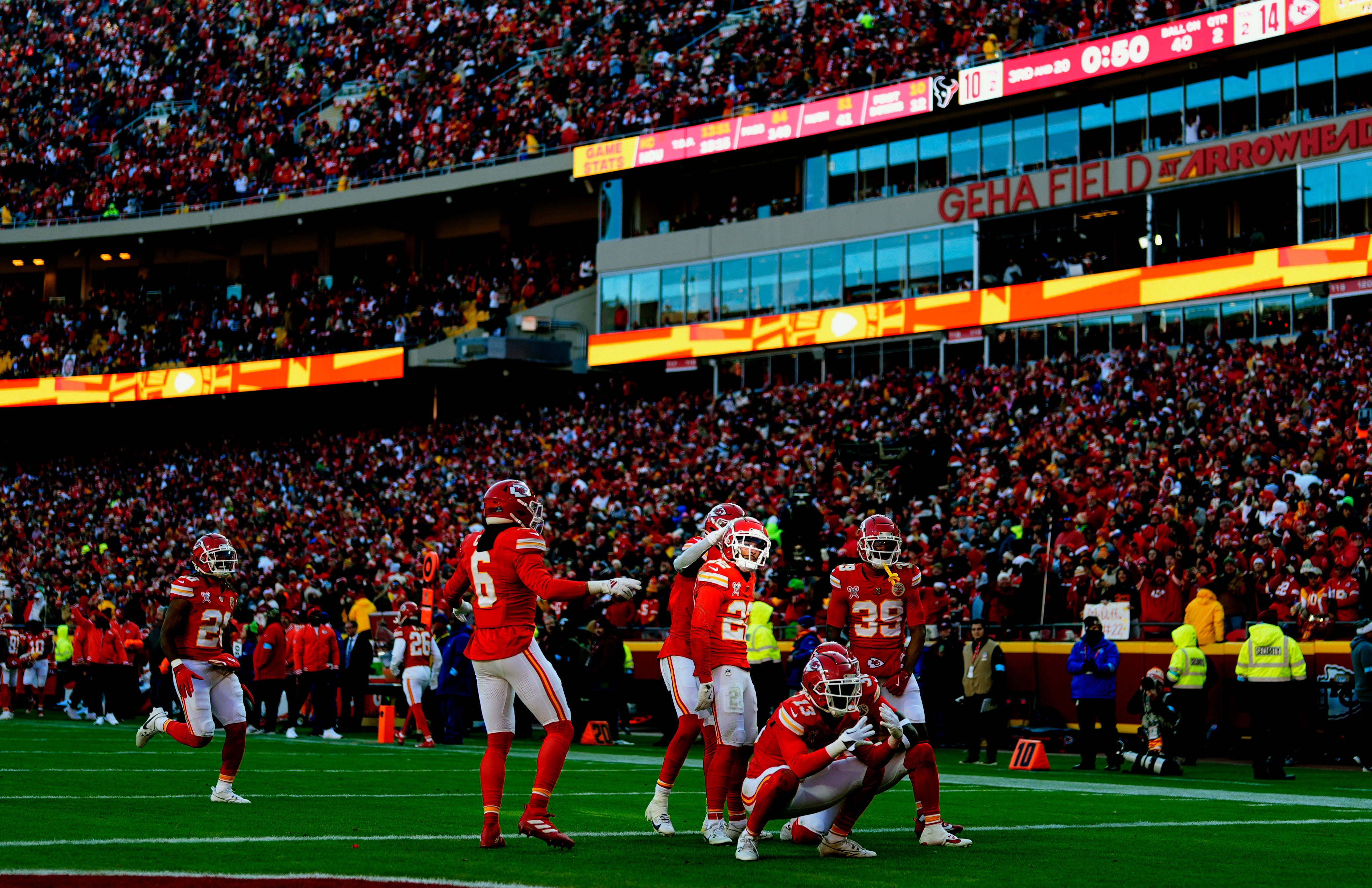 Chiefs cornerback Trent McDuffie (22) celebrates with teammates after an interception during the first half against the Texans.