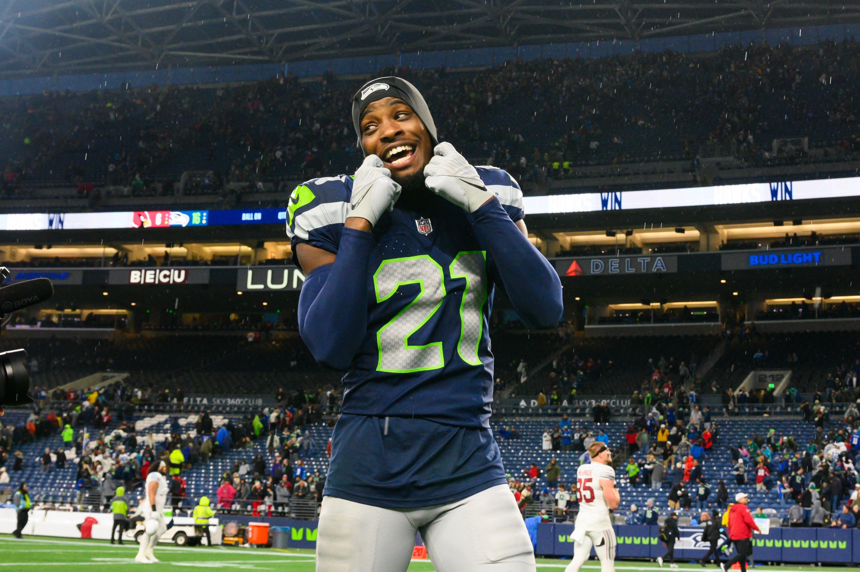 Seattle Seahawks cornerback Devon Witherspoon (21) walks off the field after the game against the Arizona Cardinals at Lumen Field.