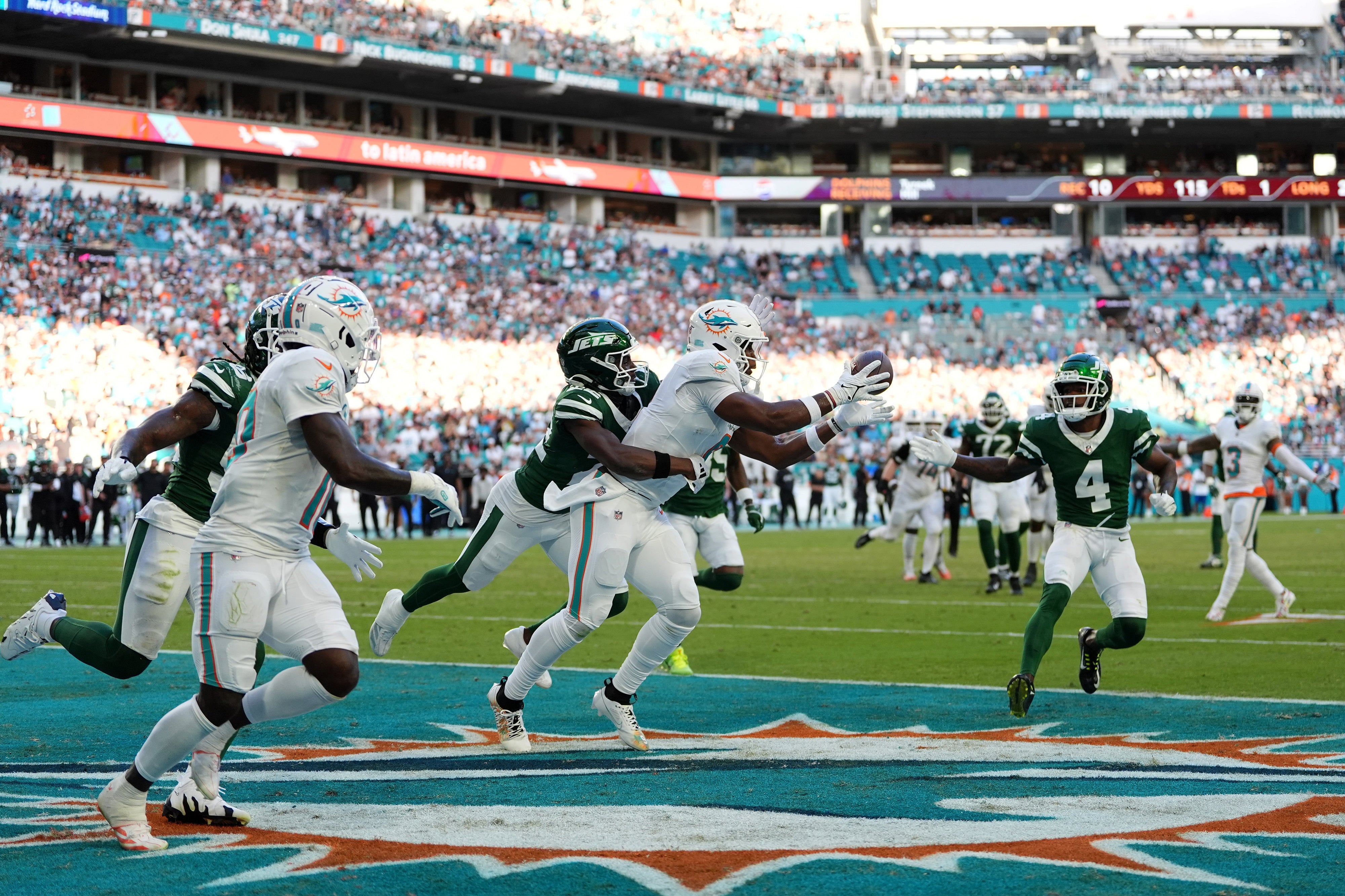 Dec 8, 2024; Miami Gardens, Florida, USA; Miami Dolphins tight end Jonnu Smith (9) makes a catch for the game winning touchdown during overtime against the New York Jets at Hard Rock Stadium.