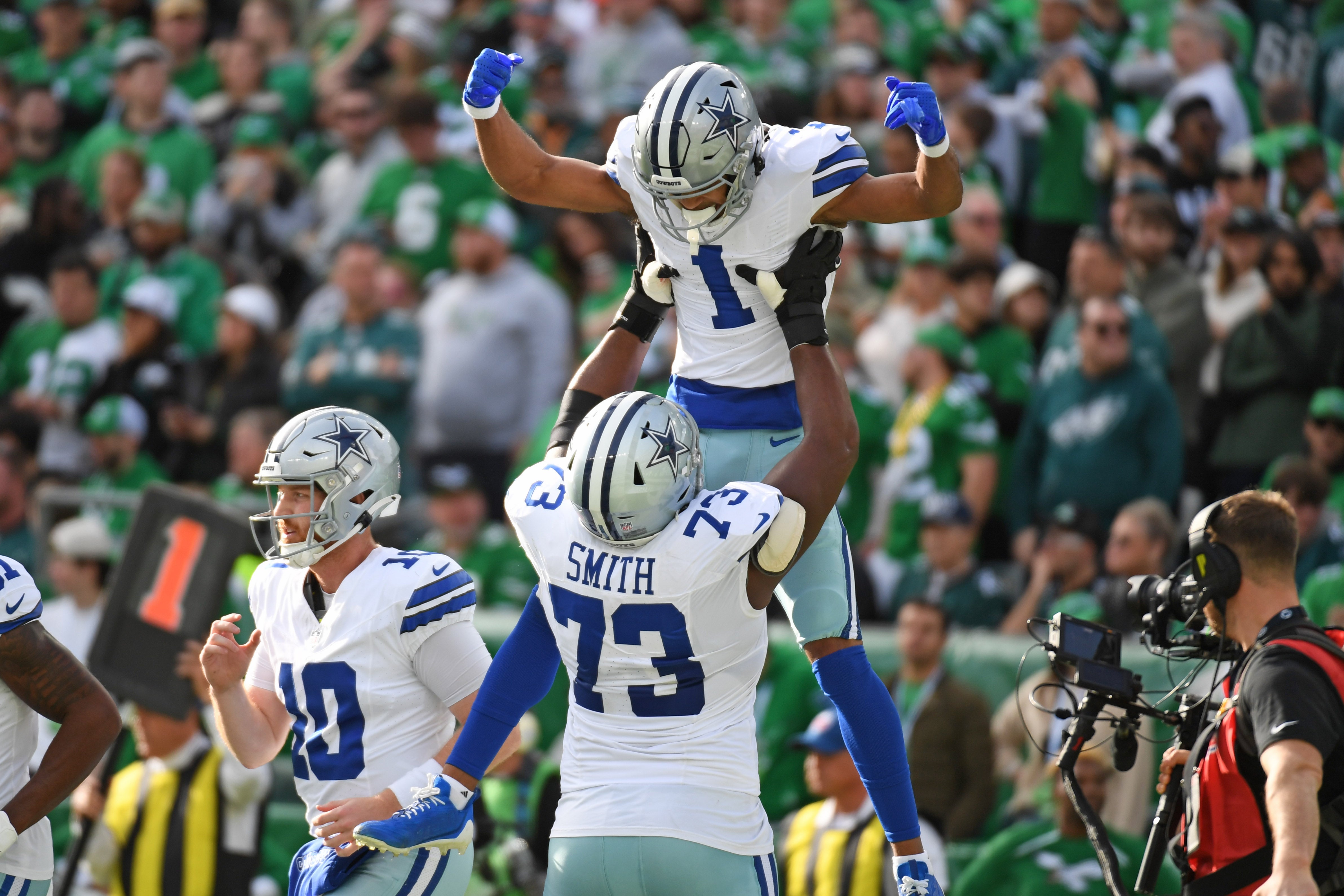 Dallas Cowboys wide receiver Jalen Tolbert (1) celebrates his touchdown catch with offensive tackle Tyler Smith (73) against the Philadelphia Eagles during the first quarter at Lincoln Financial Field.
