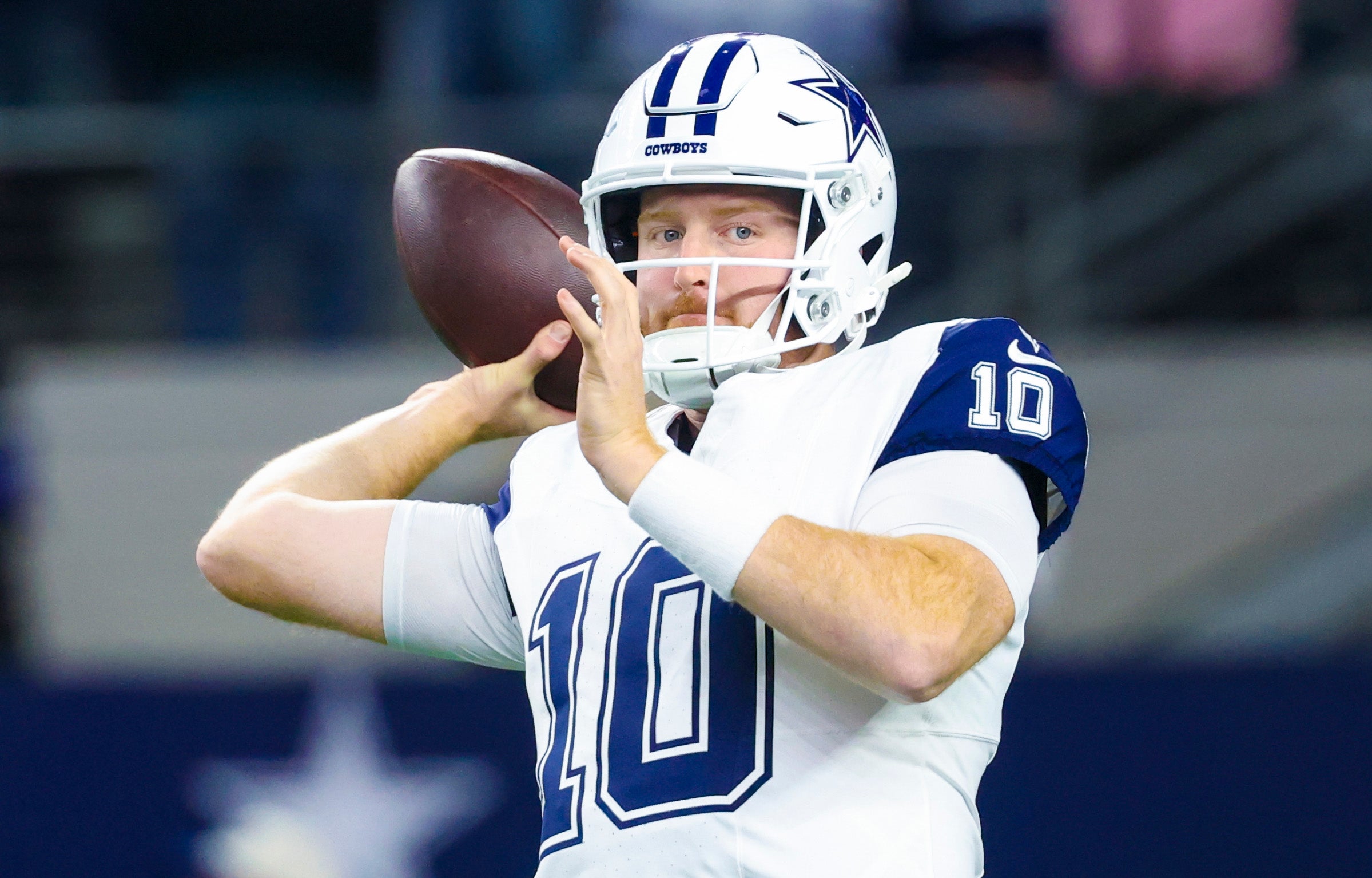 Dallas Cowboys quarterback Cooper Rush (10) warms up before the game against the Cincinnati Bengals at AT&T Stadium.