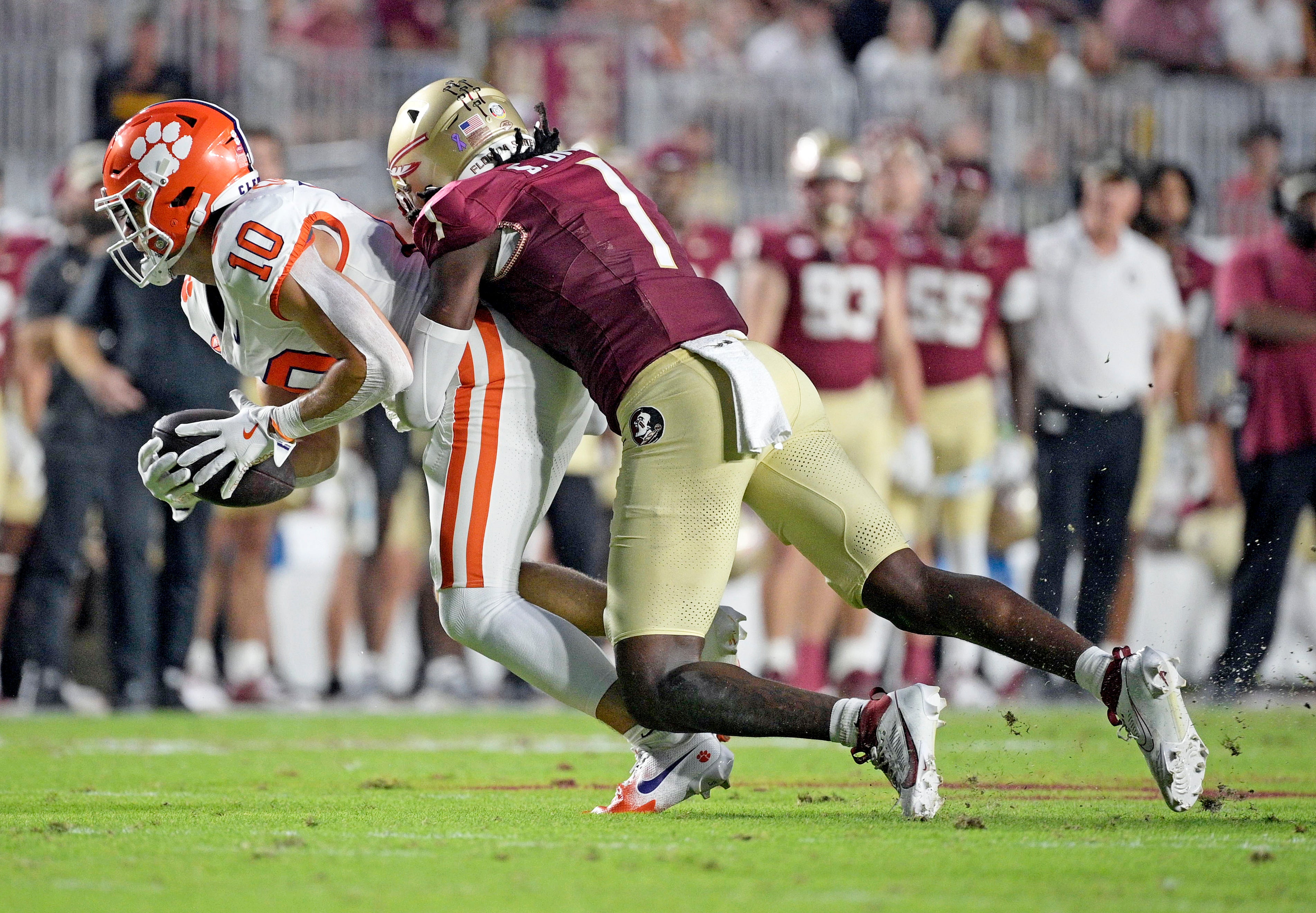 Clemson Tigers wide receiver Troy Stellato (10) is tackled by Florida State Seminoles defensive back Shyheim Brown (1) during the first half at Doak S. Campbell Stadium.